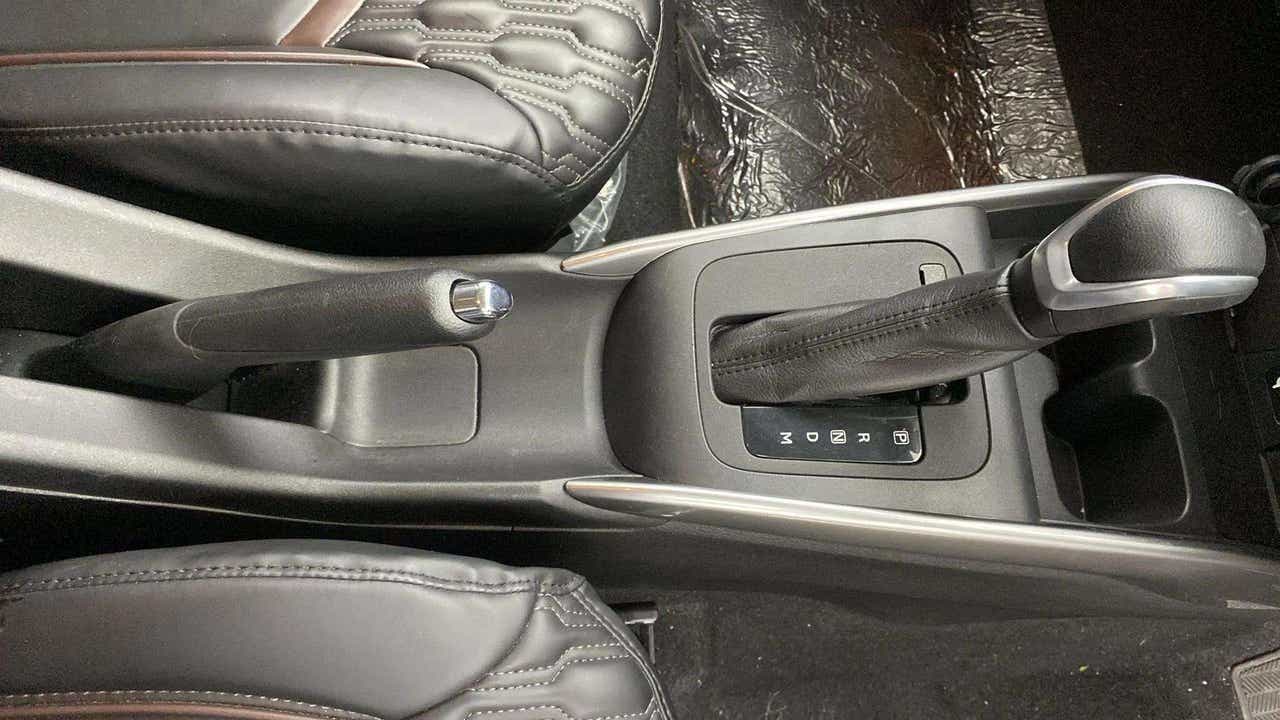 Gear lever and handbrake of a Maruti Suzuki FRONX
