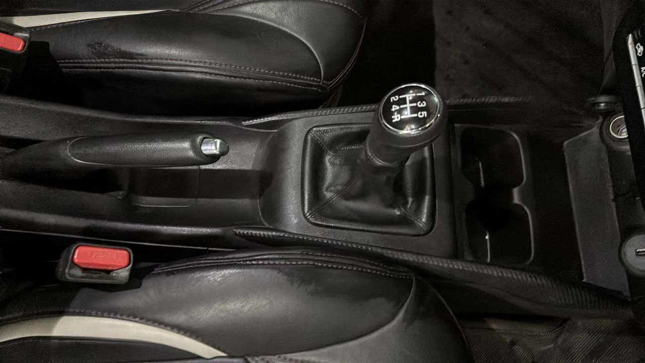 Gear lever, handbrake and console area of a Maruti Suzuki FRONX