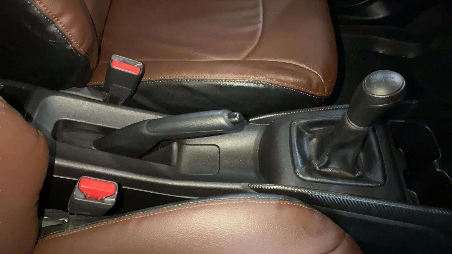 Gear lever and handbrake area of a Maruti Suzuki FRONX