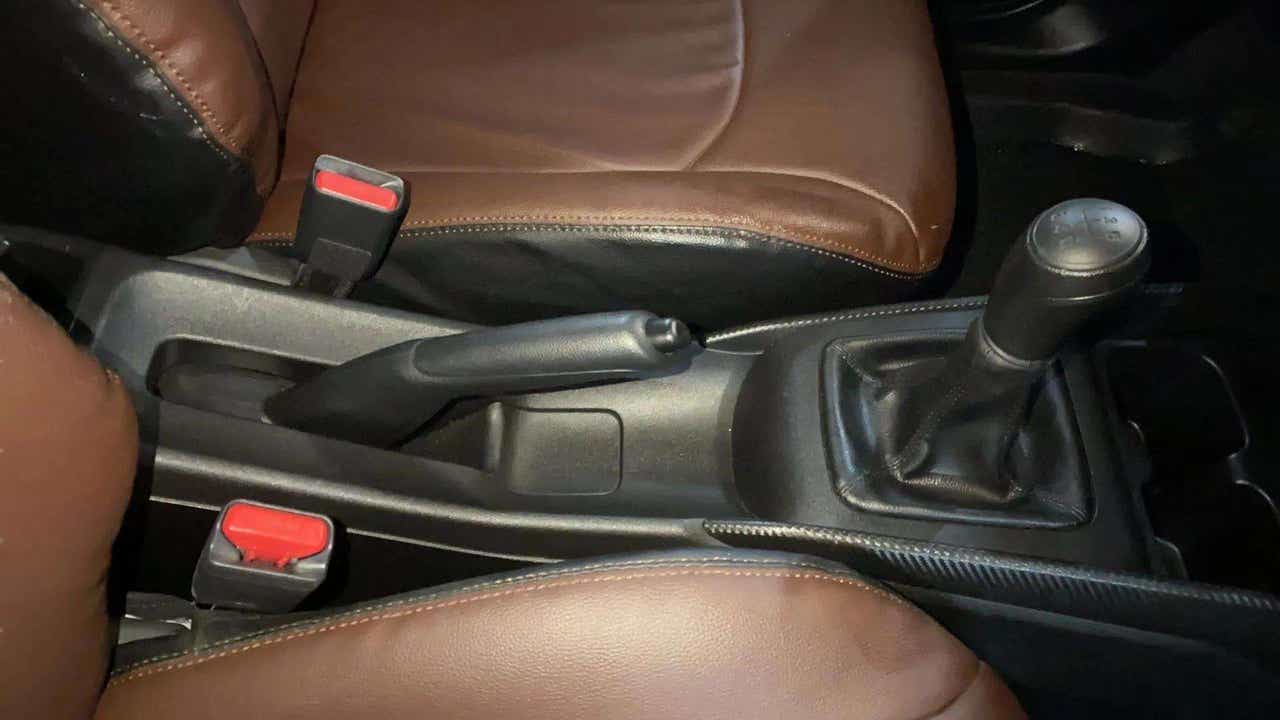 Gear lever and handbrake area of a Maruti Suzuki FRONX