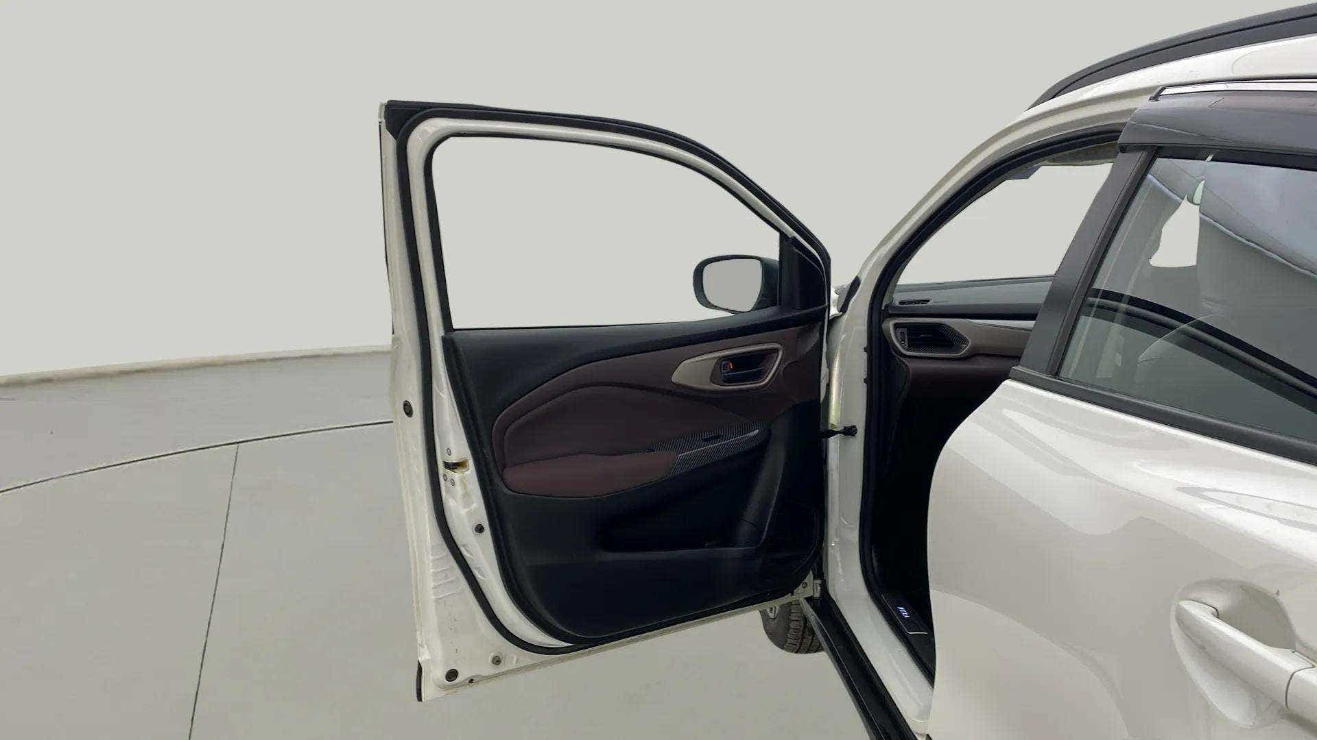 Front left door open view of a Maruti Suzuki FRONX