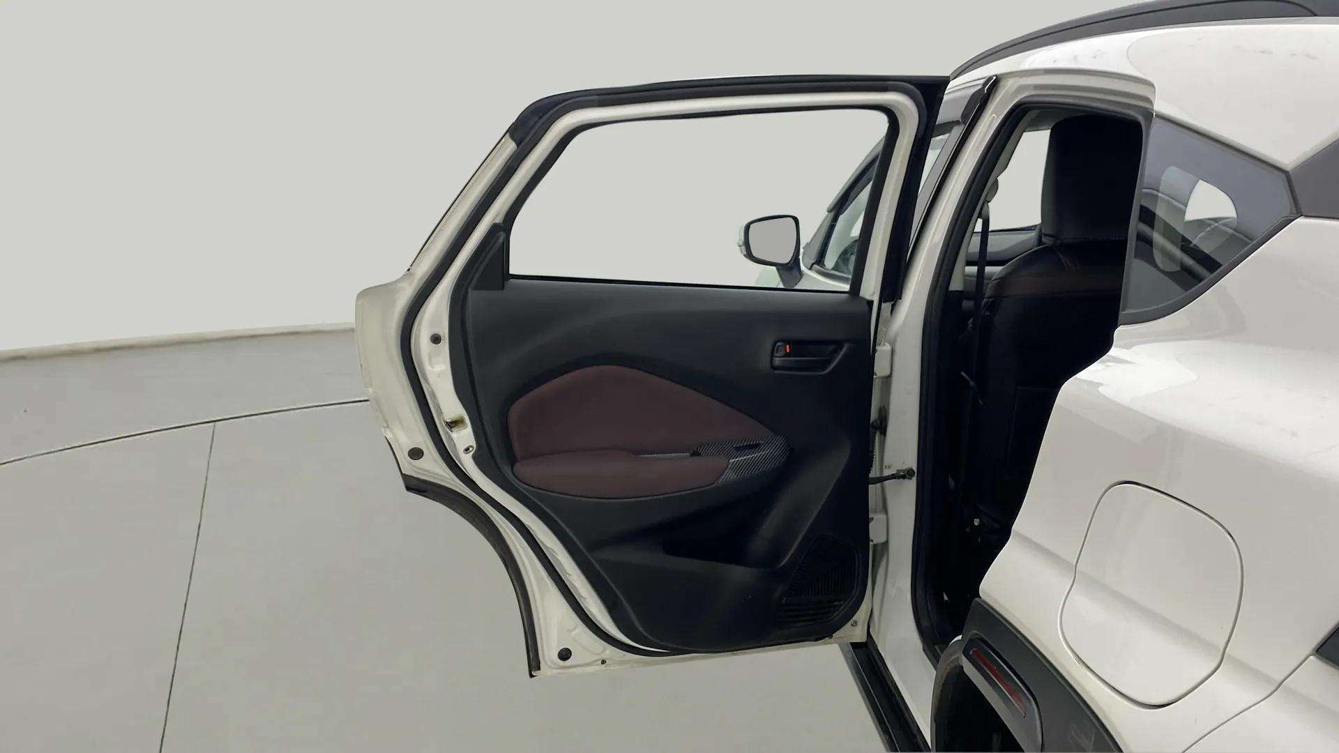 Rear left door open view of a Maruti Suzuki FRONX