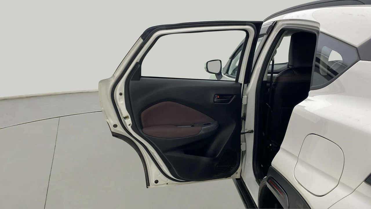 Rear left door open view of a Maruti Suzuki FRONX