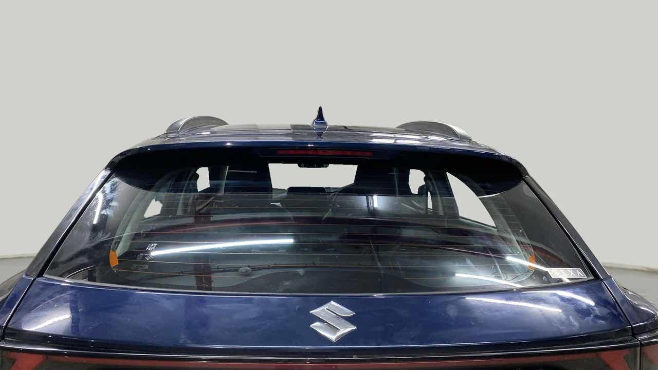 Rear view of a Nexa Blue Maruti Suzuki FRONX