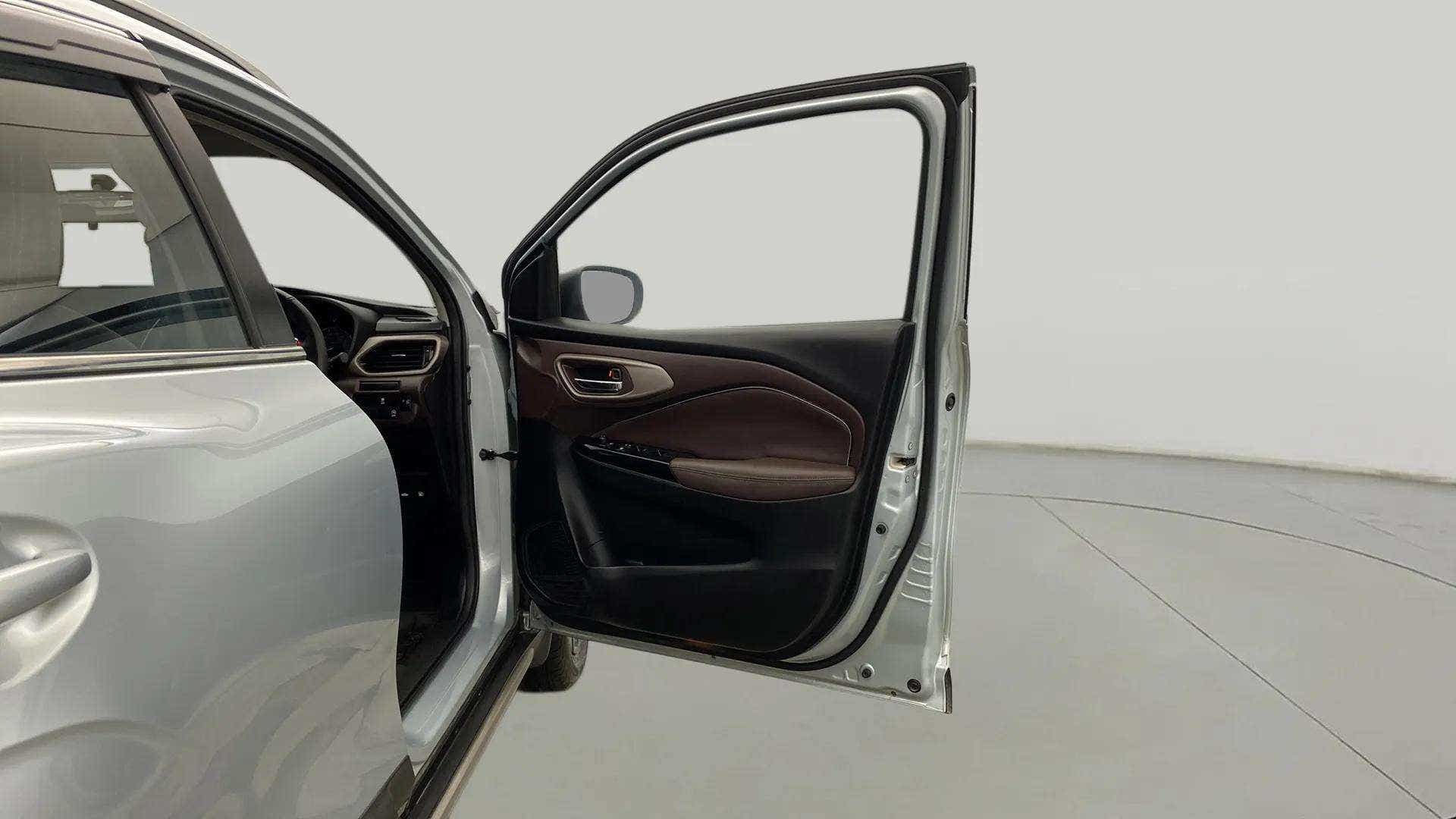 Driver side door and dashboard of a Maruti Suzuki FRONX