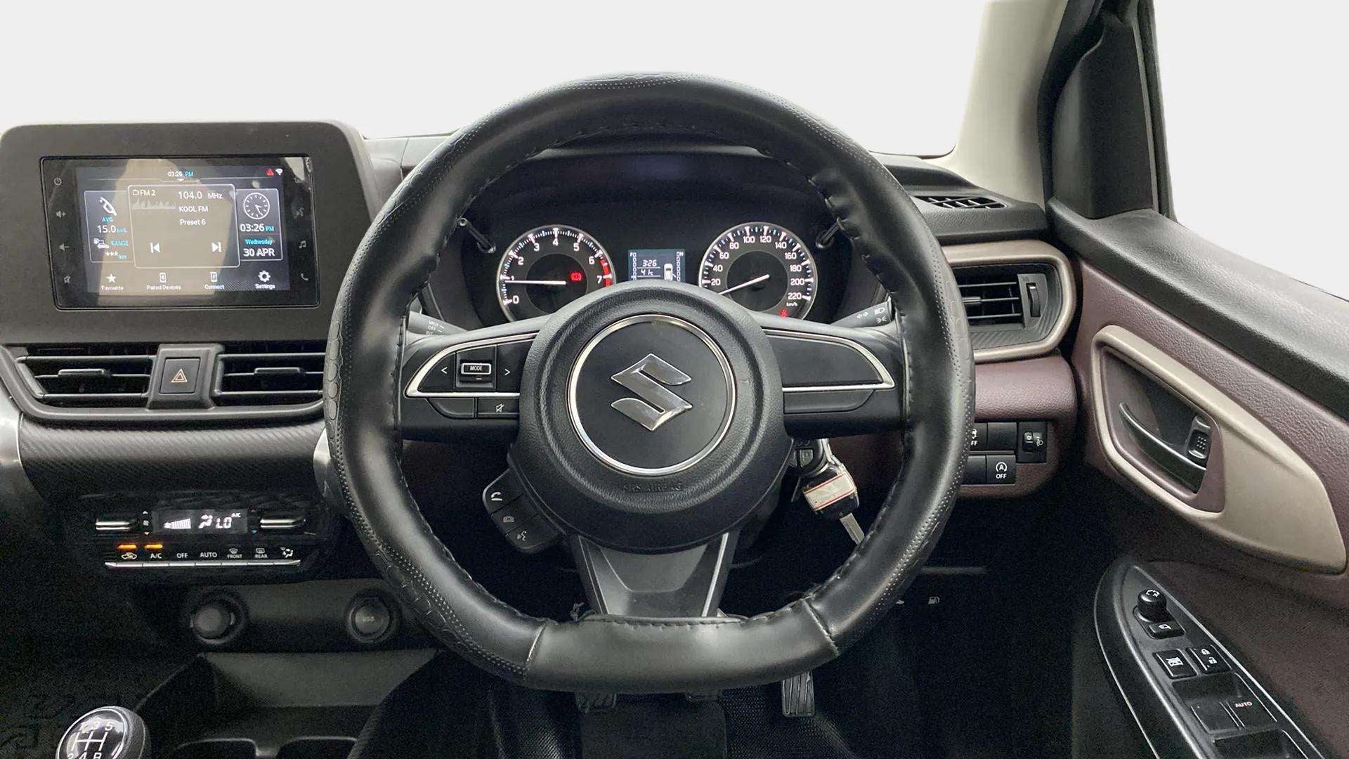 Dashboard and steering wheel view of a Maruti Suzuki FRONX