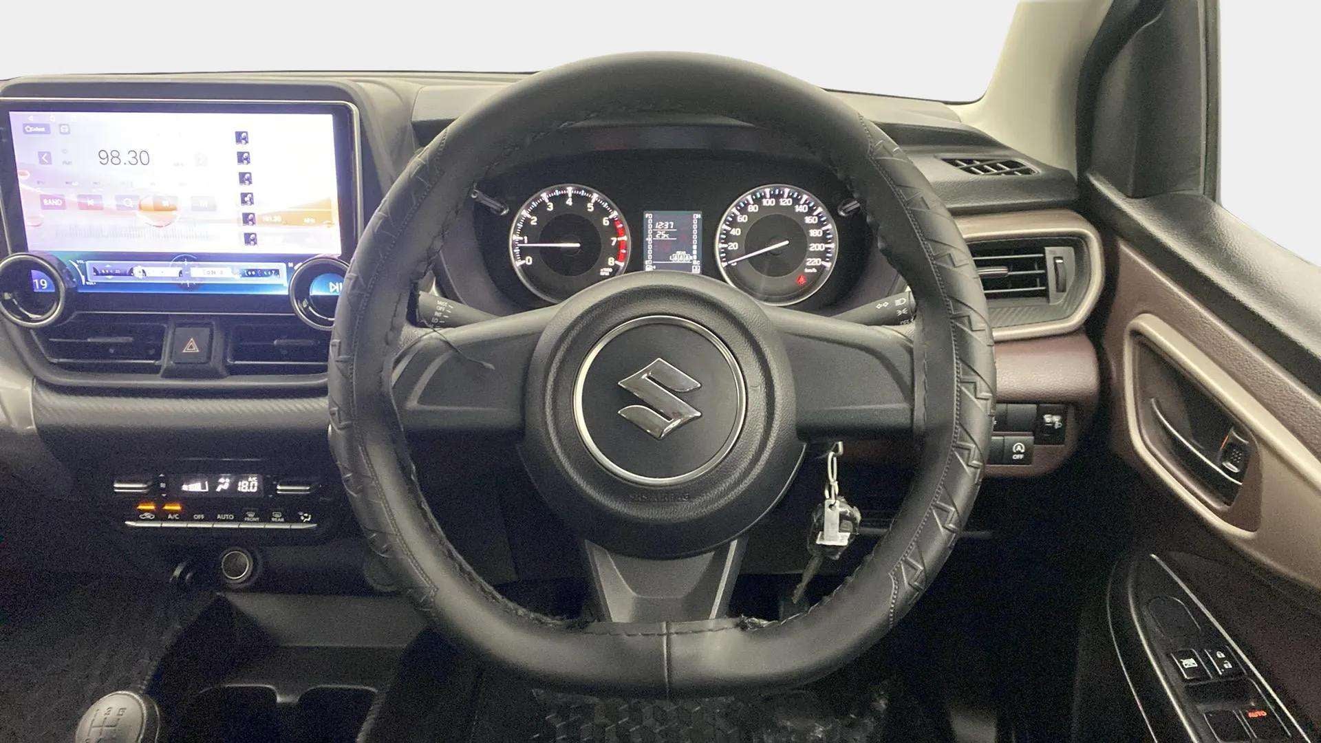Dashboard and steering wheel of a Maruti Suzuki FRONX