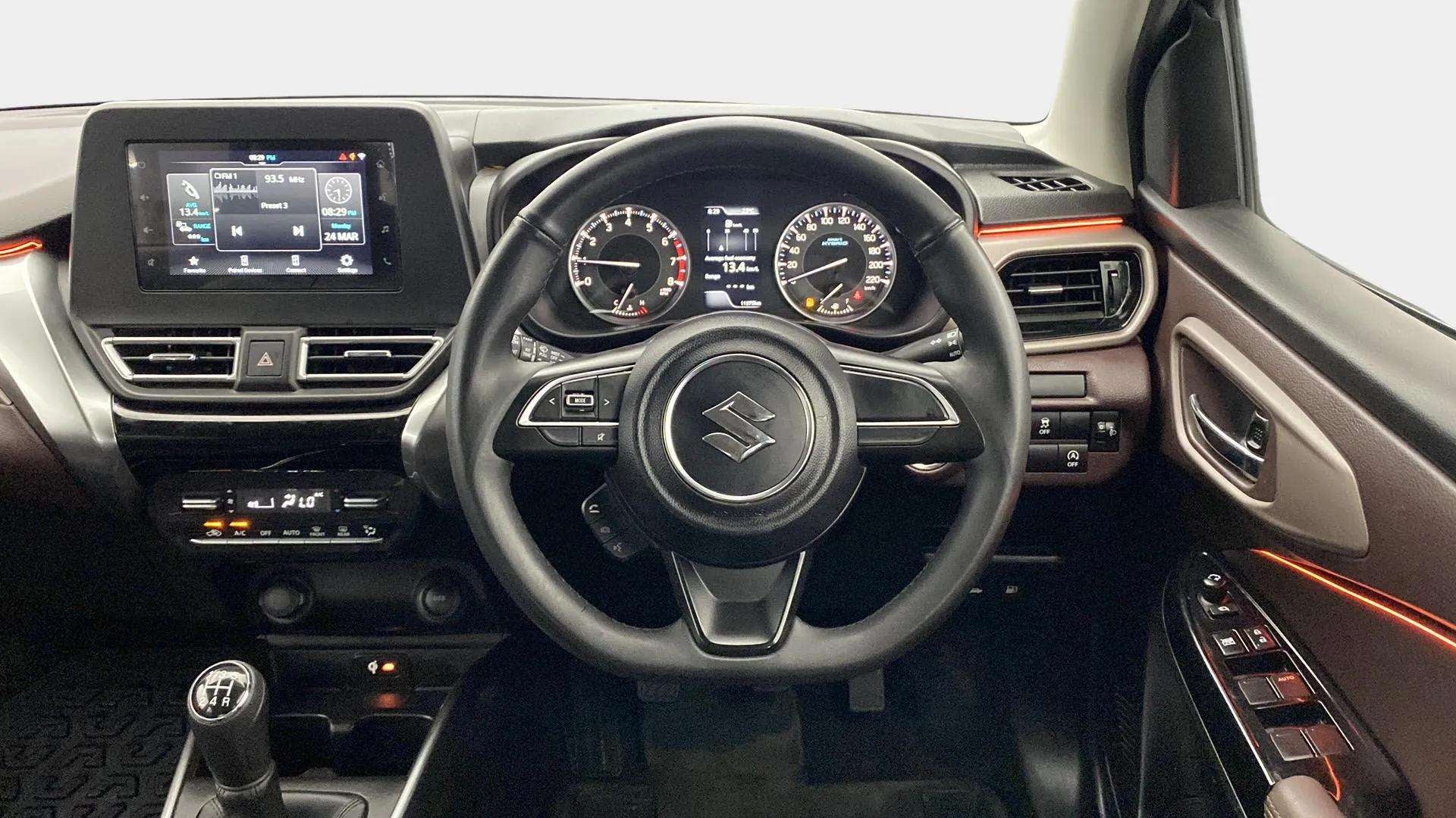Interior dashboard and steering wheel of a Maruti Suzuki FRONX