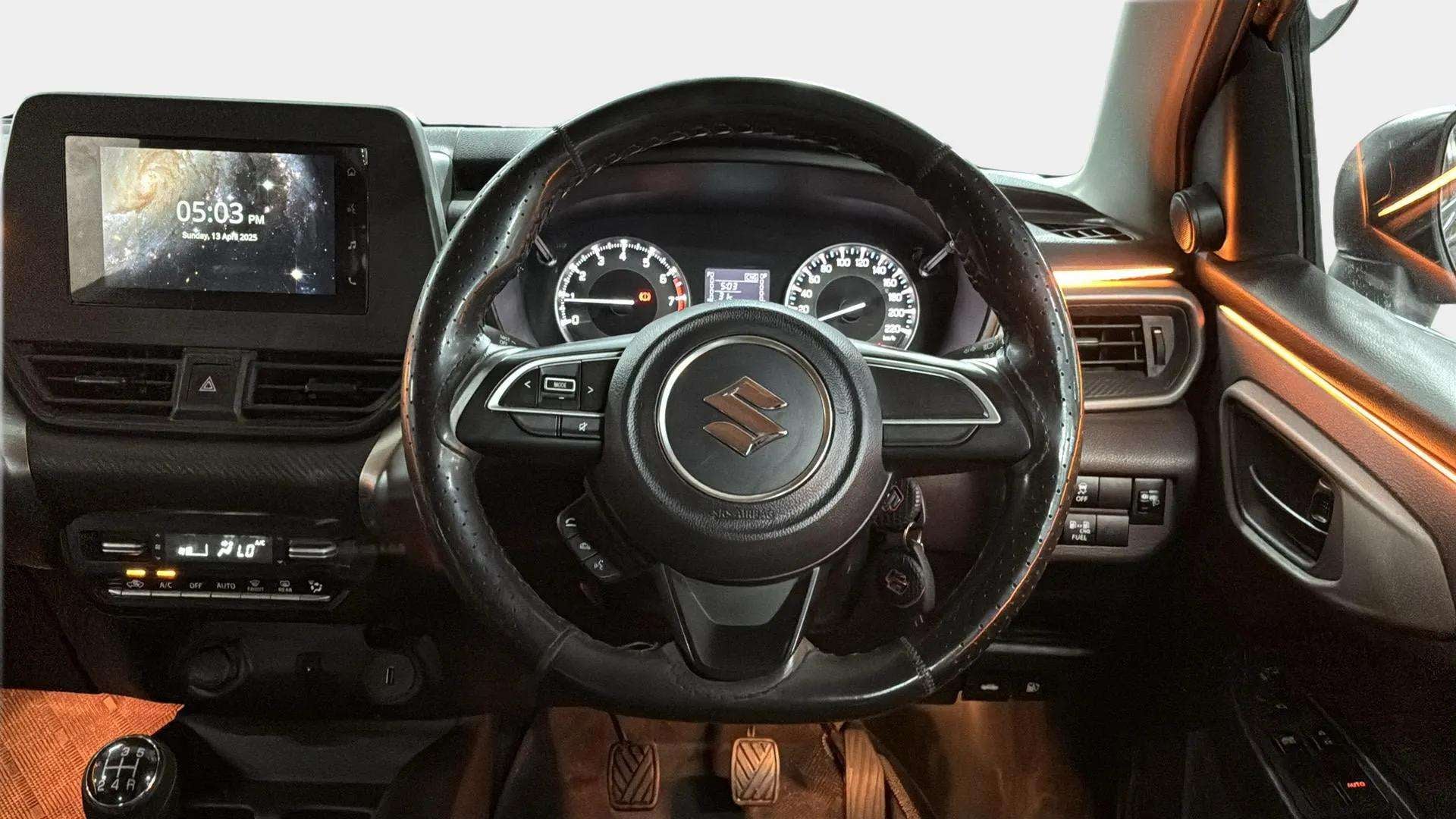 Interior dashboard view of a Maruti Suzuki FRONX