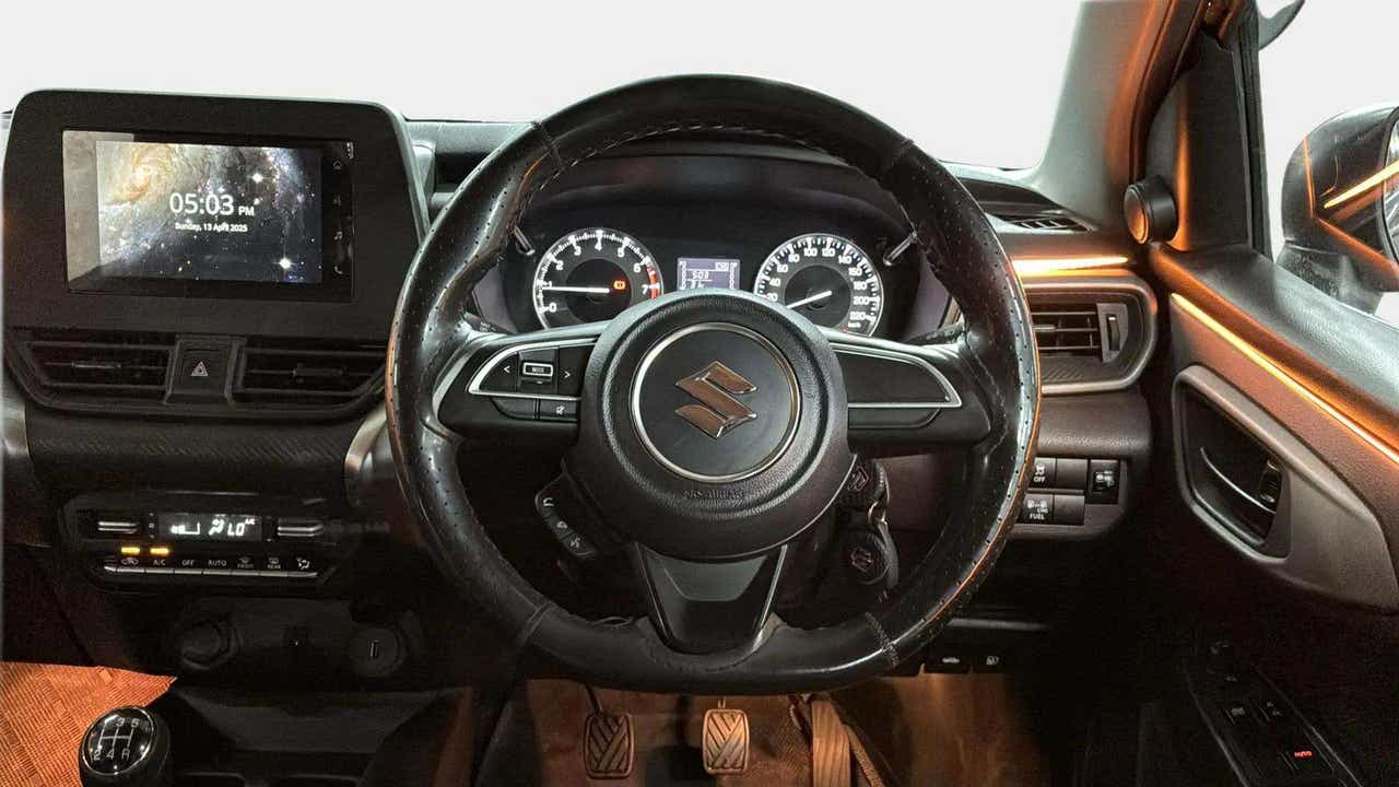 Interior dashboard view of a Maruti Suzuki FRONX