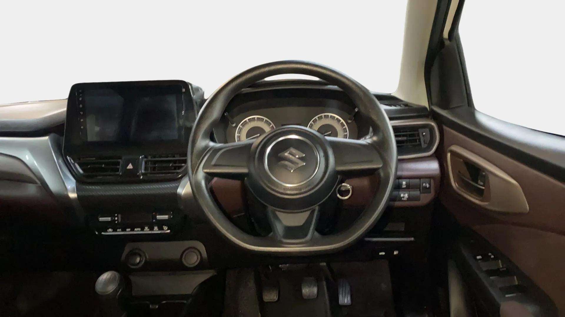 Dashboard and steering wheel view of a Maruti Suzuki FRONX