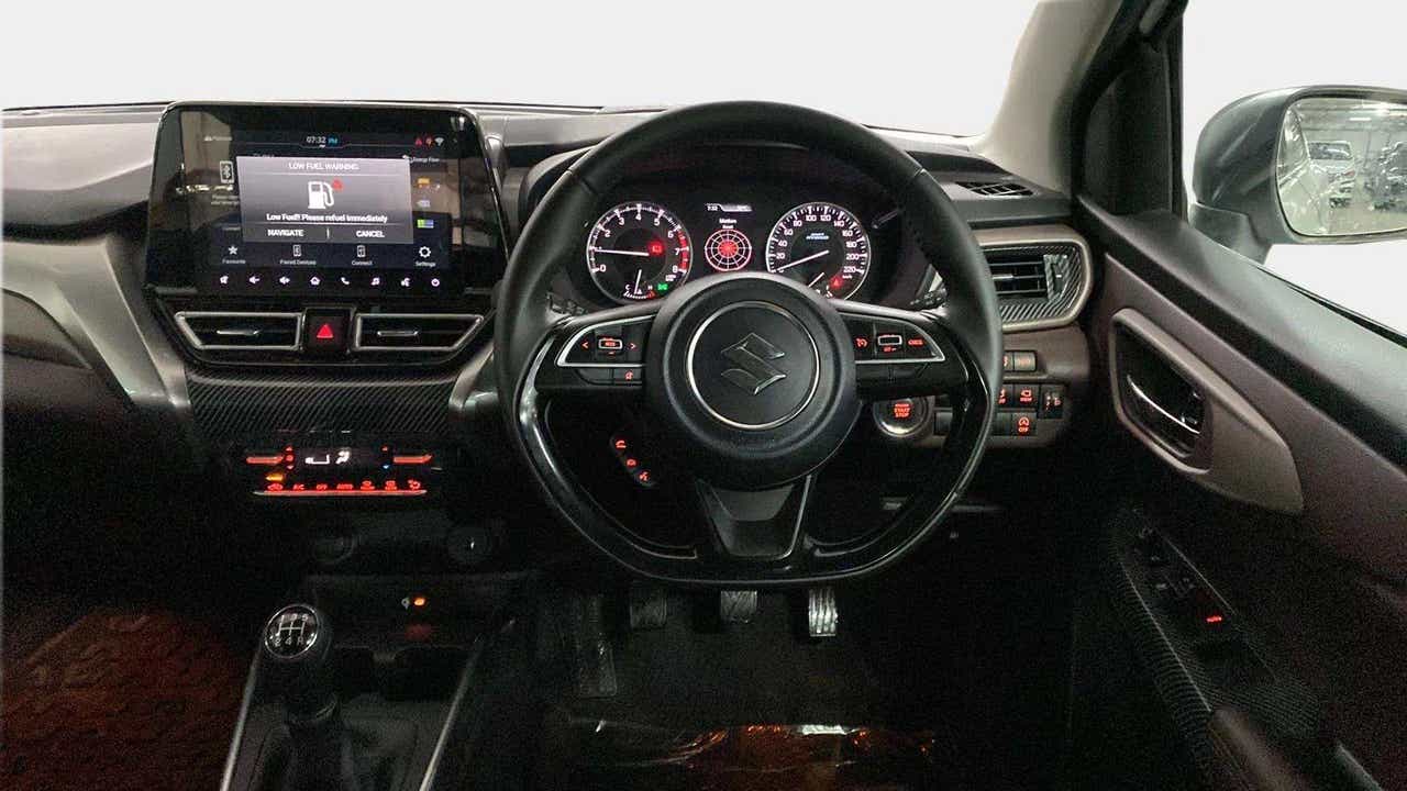 Dashboard and steering wheel of a Maruti Suzuki FRONX