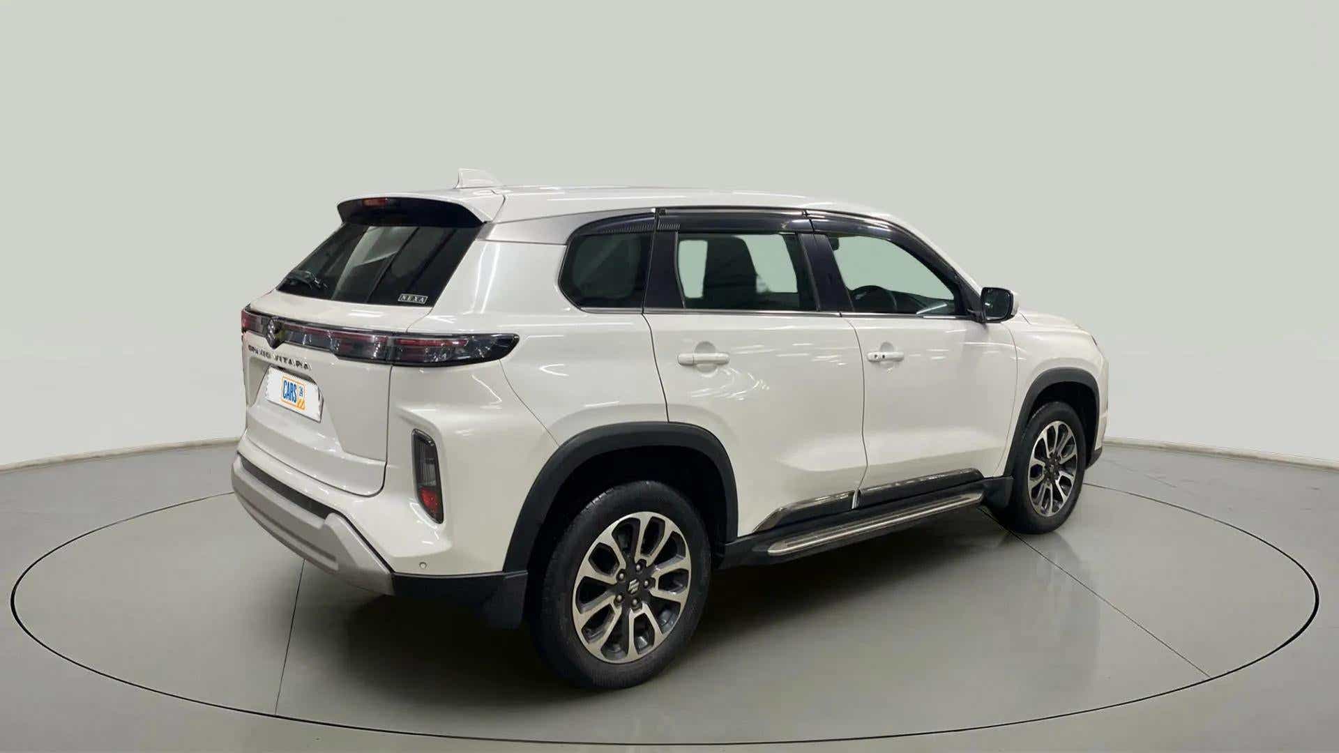 Rear three-quarter view of a splendid silver Maruti Suzuki Grand Vitara