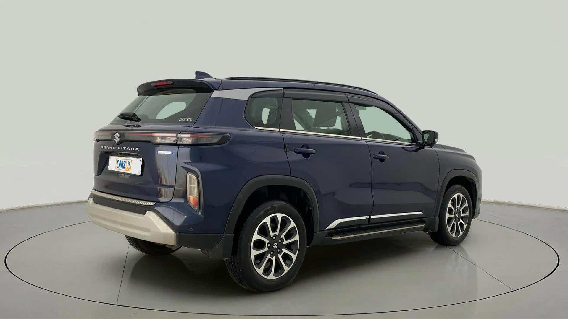 Rear three-quarter view of a Nexa Blue Maruti Suzuki Grand Vitara