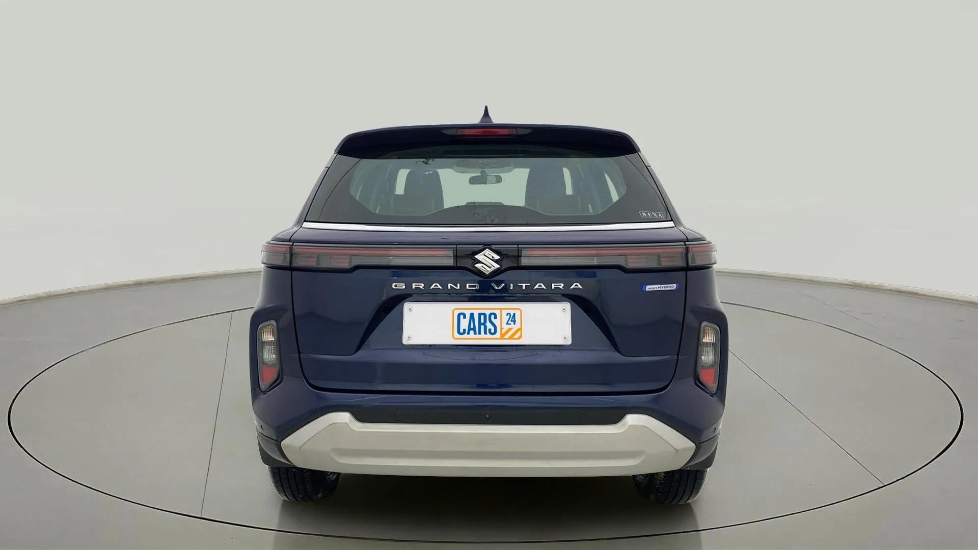 Rear view of a Nexa Blue Maruti Suzuki Grand Vitara