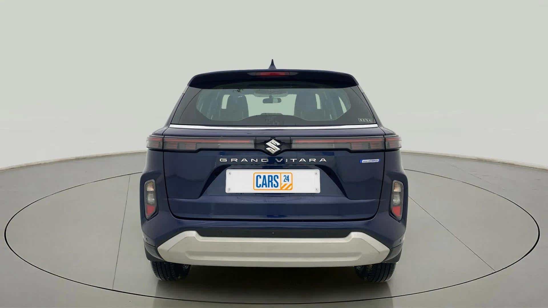 Rear view of a Nexa Blue Maruti Suzuki Grand Vitara