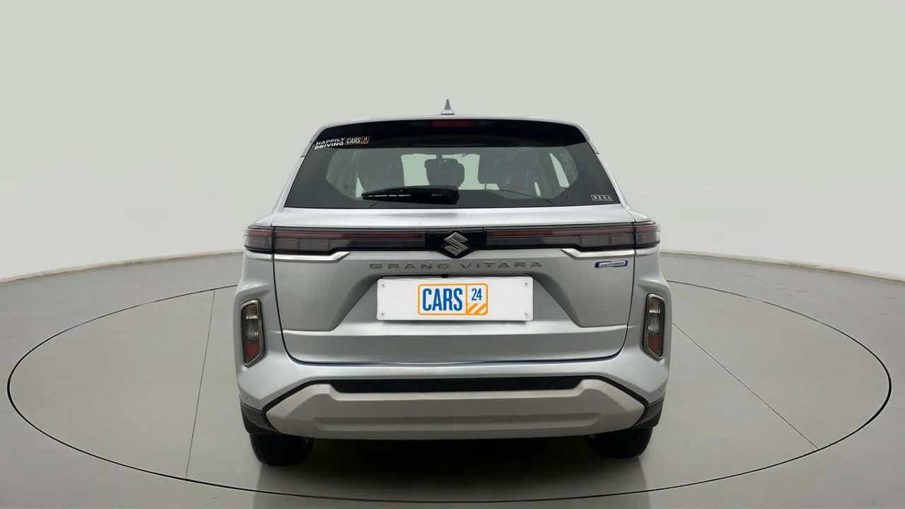 Rear view of a Splendid Silver Maruti Suzuki Grand Vitara