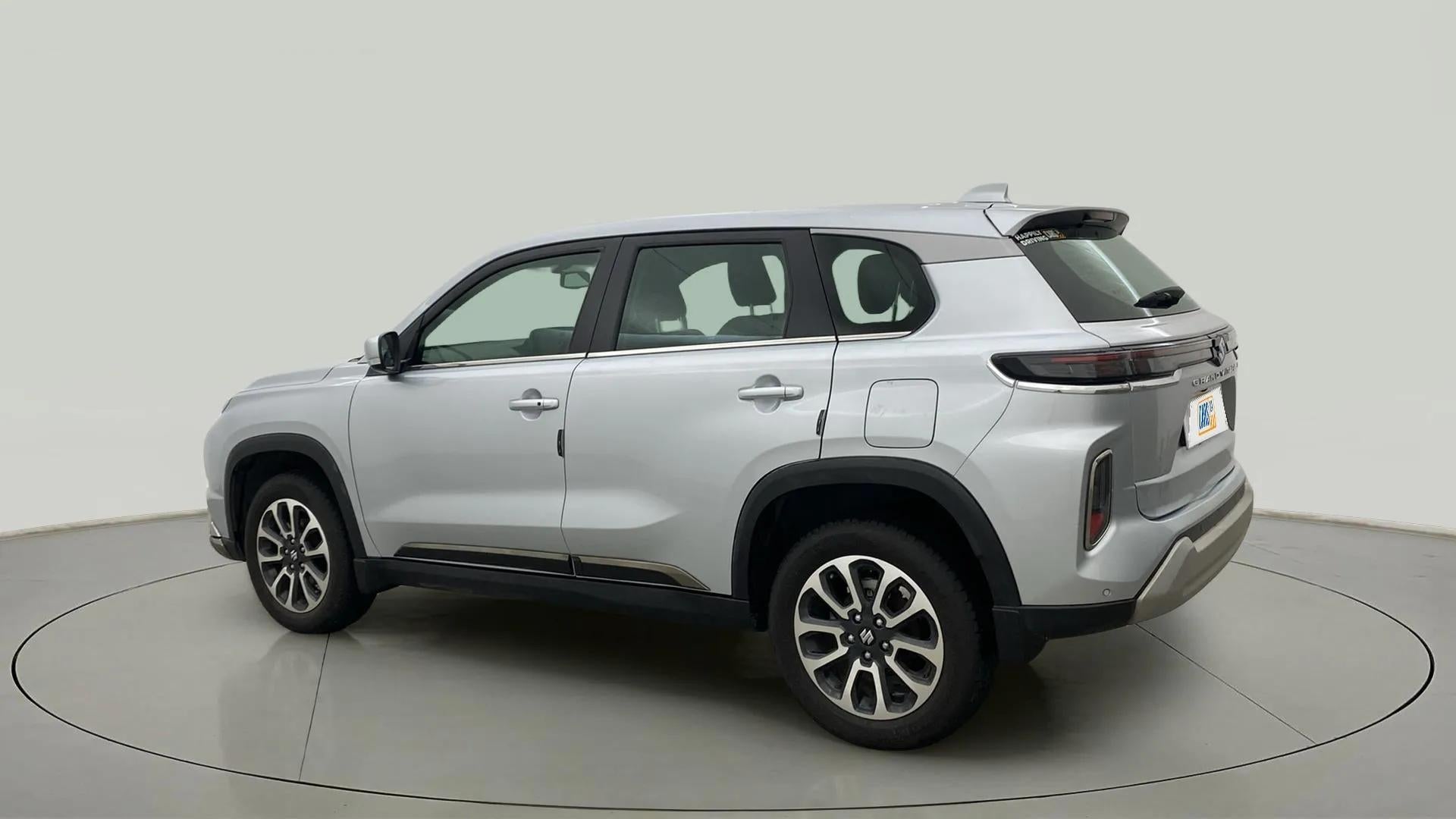 Rear three quarter of a Splendid Silver Maruti Suzuki Grand Vitara