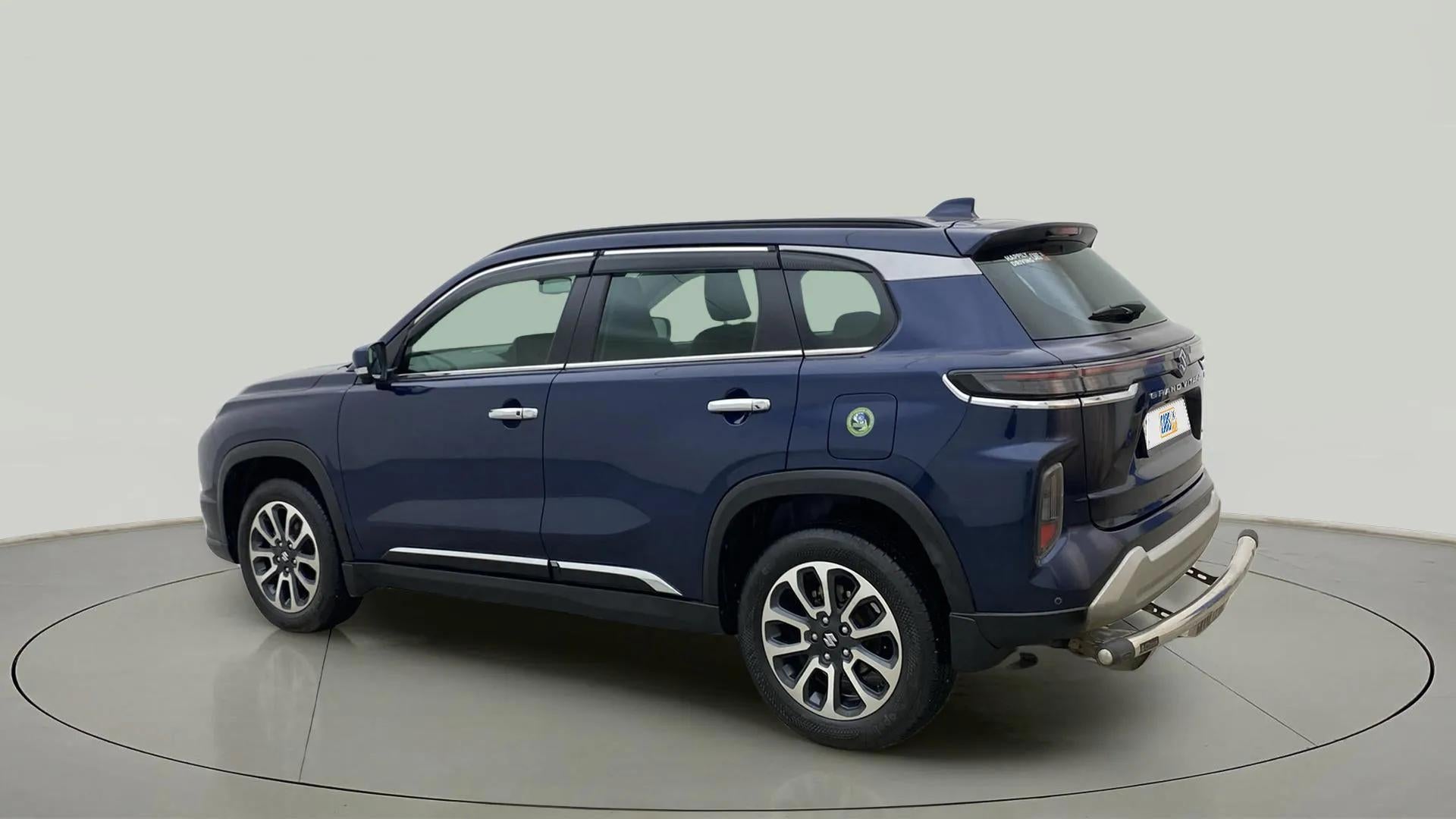 Rear three quarter of a Nexa Blue Maruti Suzuki Grand Vitara