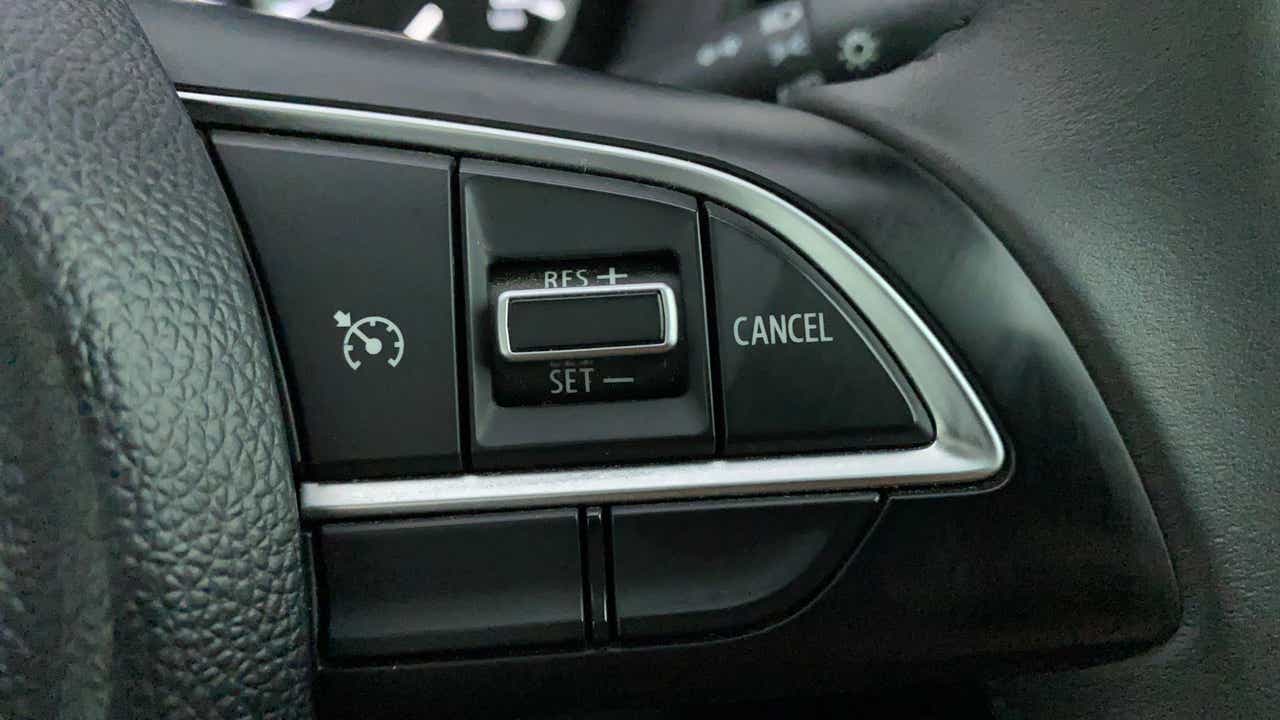 Cruise control buttons on a Maruti Suzuki Grand Vitara steering wheel