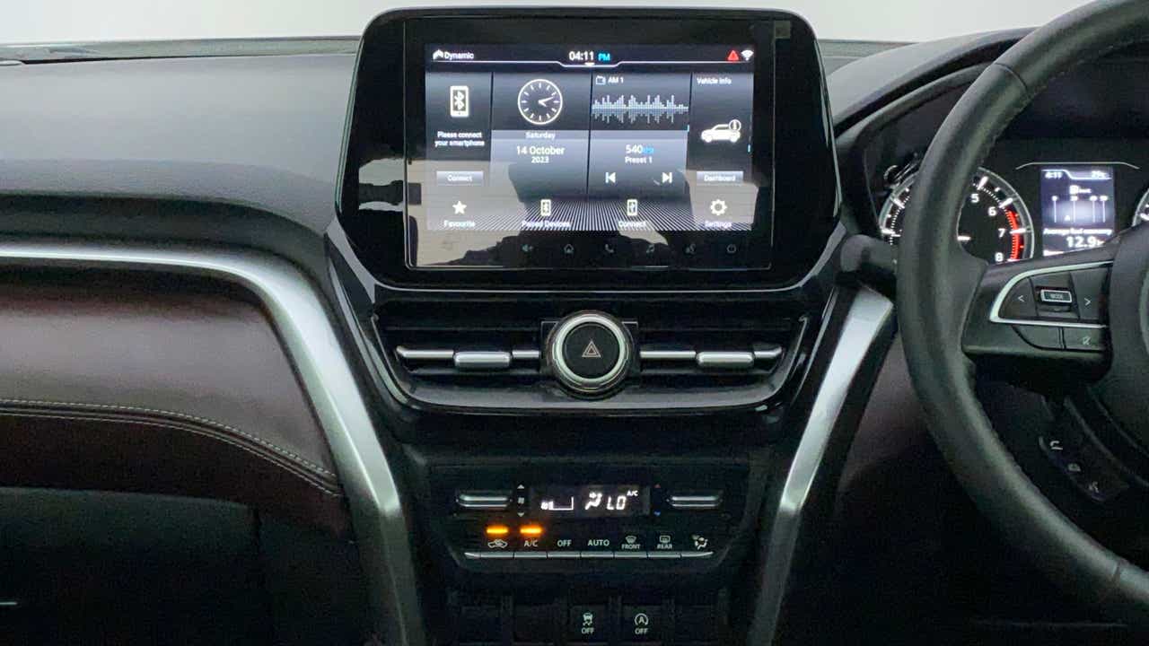 Dashboard and infotainment screen of a Maruti Suzuki Grand Vitara
