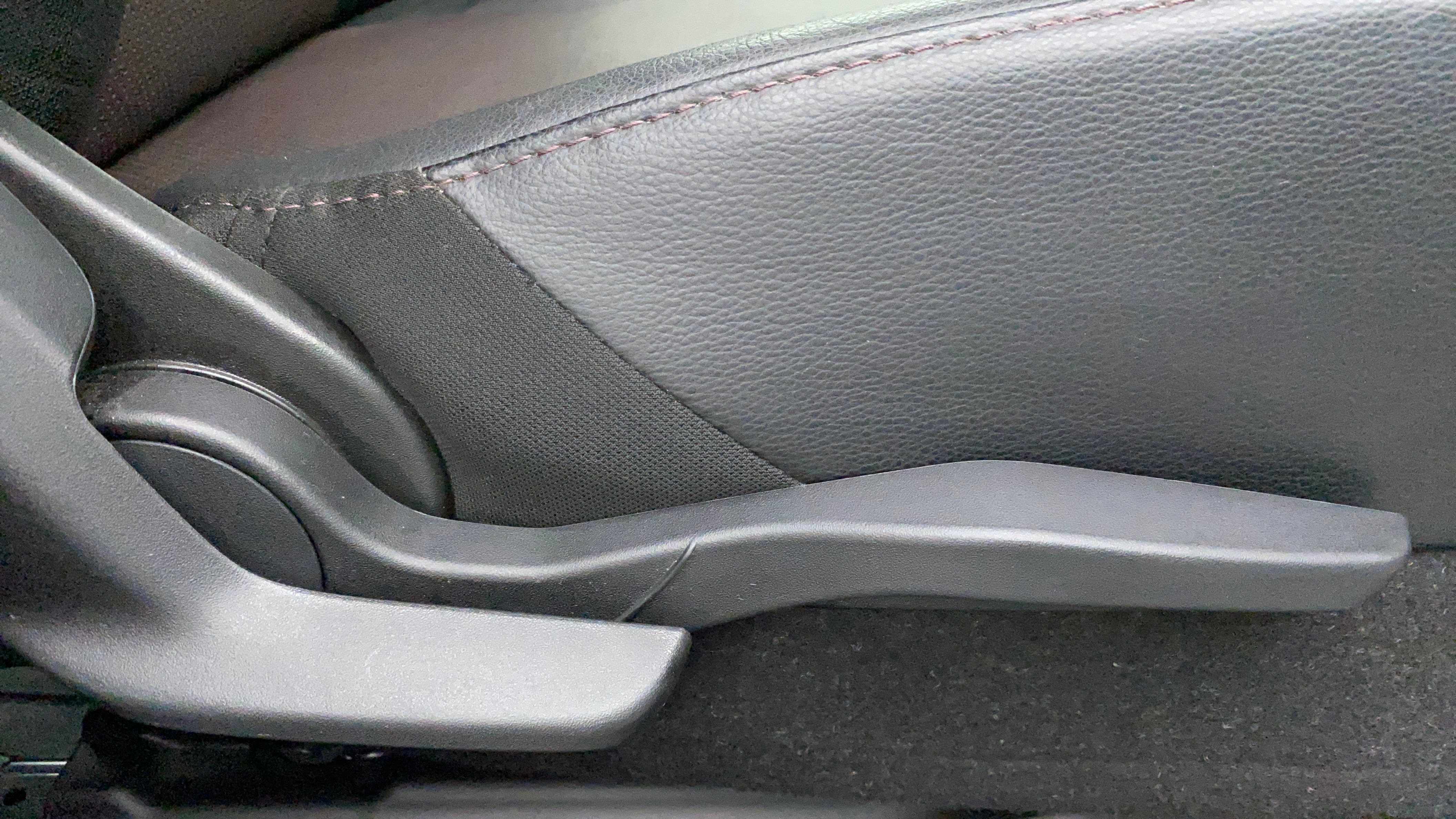 Side seat adjuster lever of a Maruti Suzuki Grand Vitara