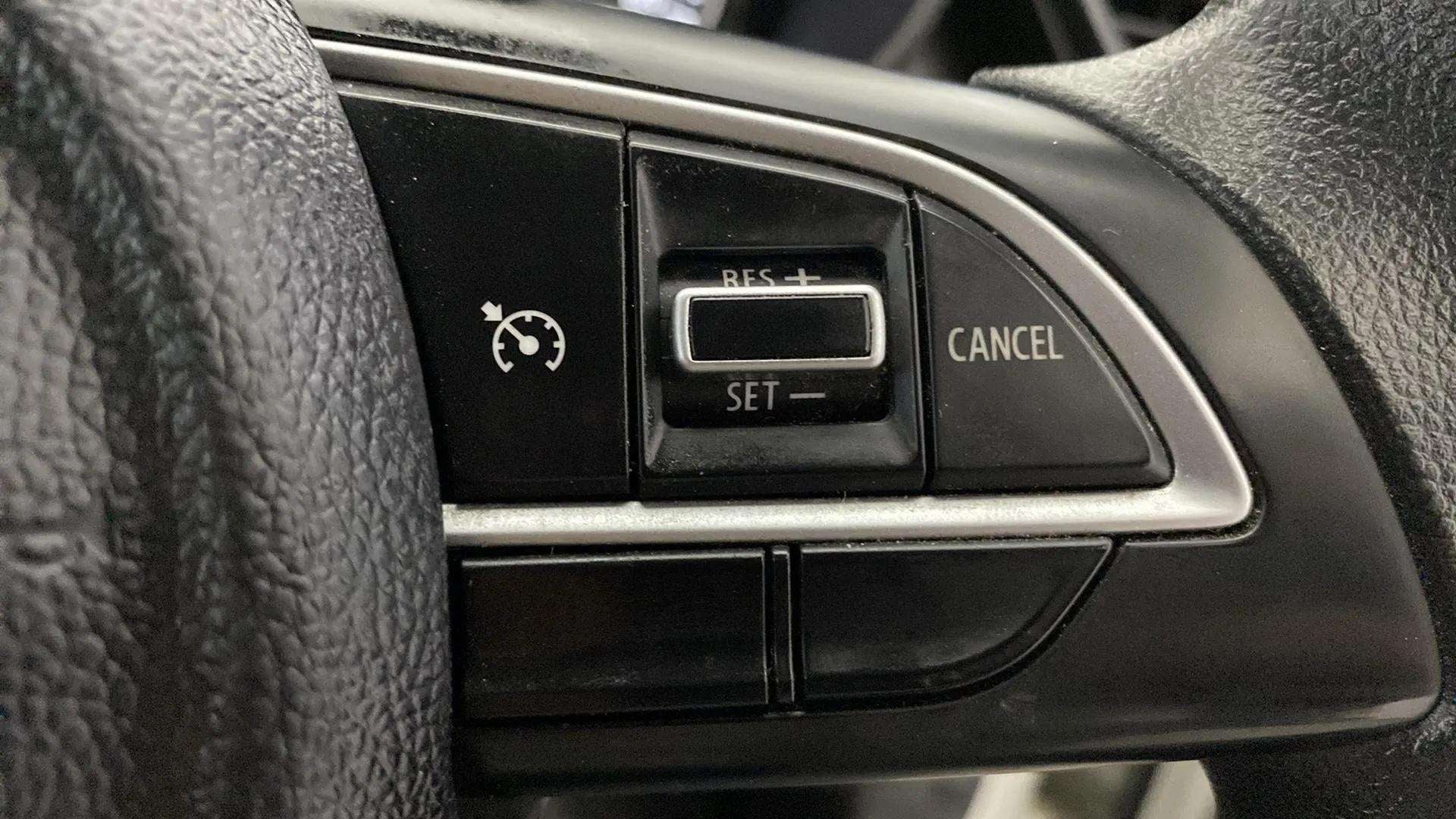 Steering wheel cruise control buttons of a Maruti Suzuki Grand Vitara