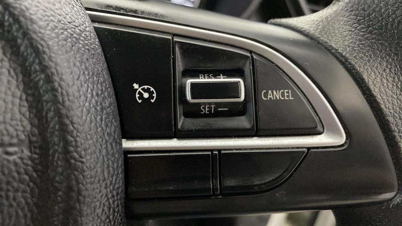 Steering wheel cruise control buttons of a Maruti Suzuki Grand Vitara