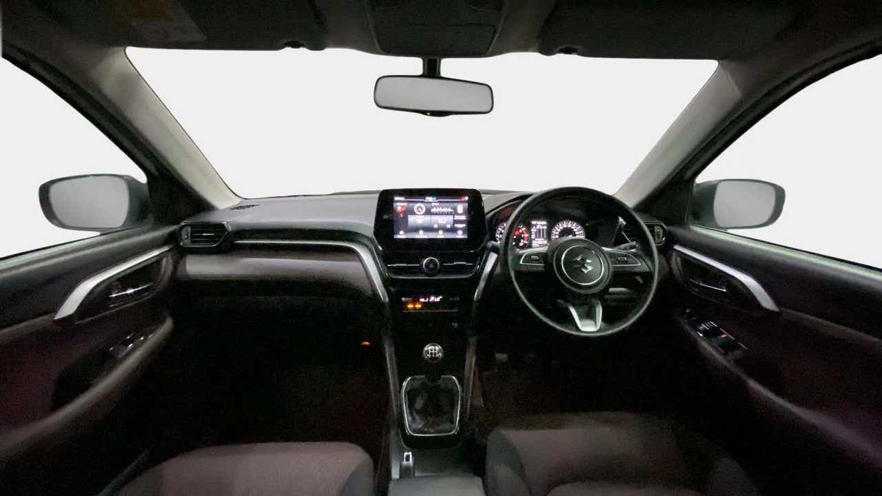 Dashboard and steering wheel of a Maruti Suzuki Grand Vitara