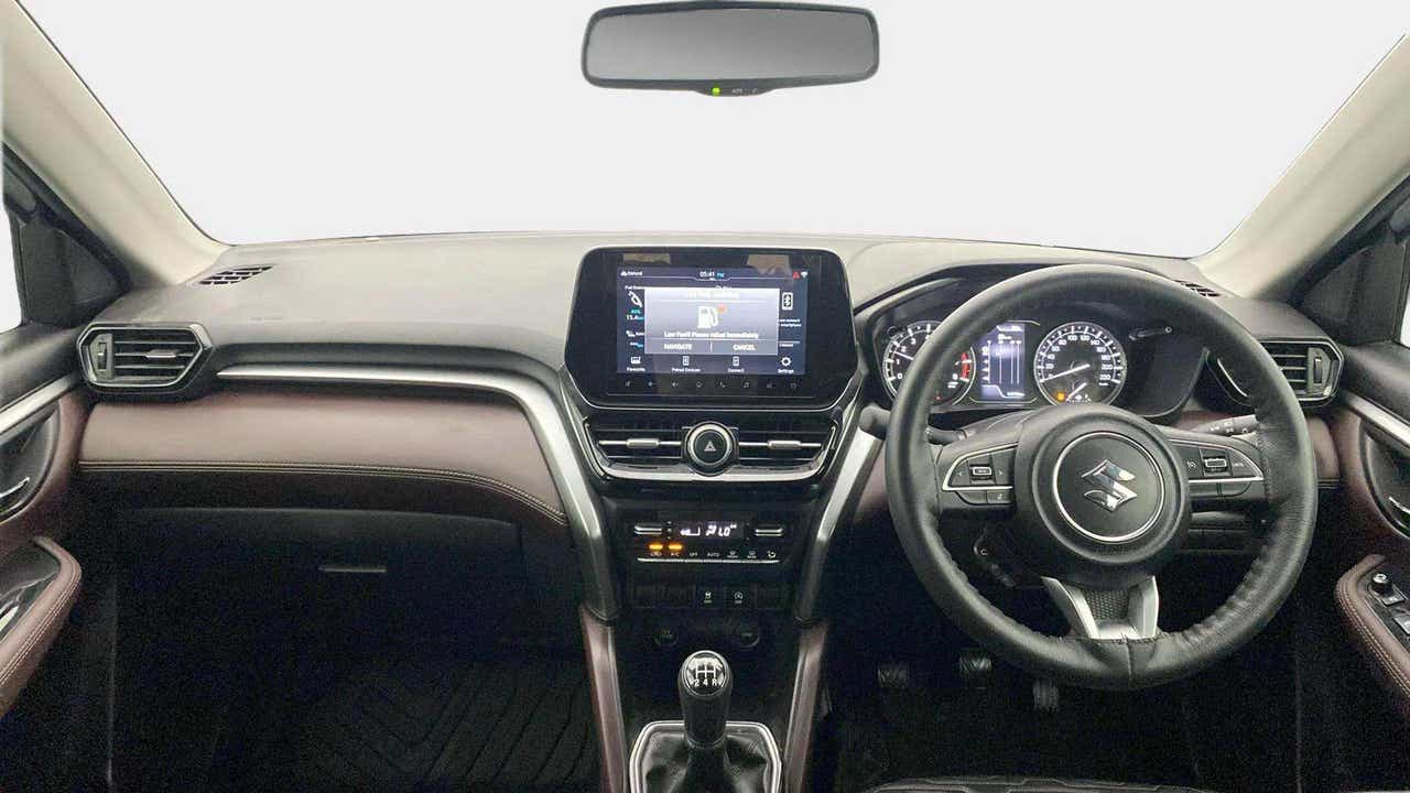 Dashboard and steering wheel of a Maruti Suzuki Grand Vitara