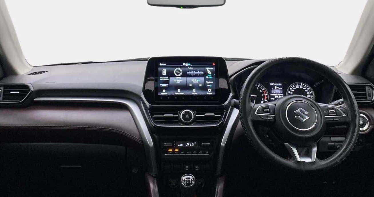 Interior dashboard view of a Maruti Suzuki Grand Vitara