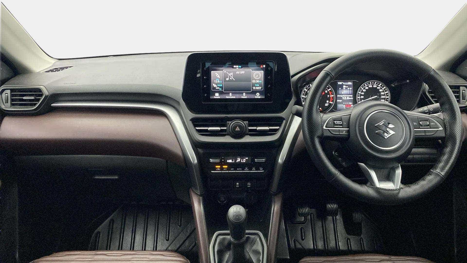 Dashboard and steering wheel of a Maruti Suzuki Grand Vitara