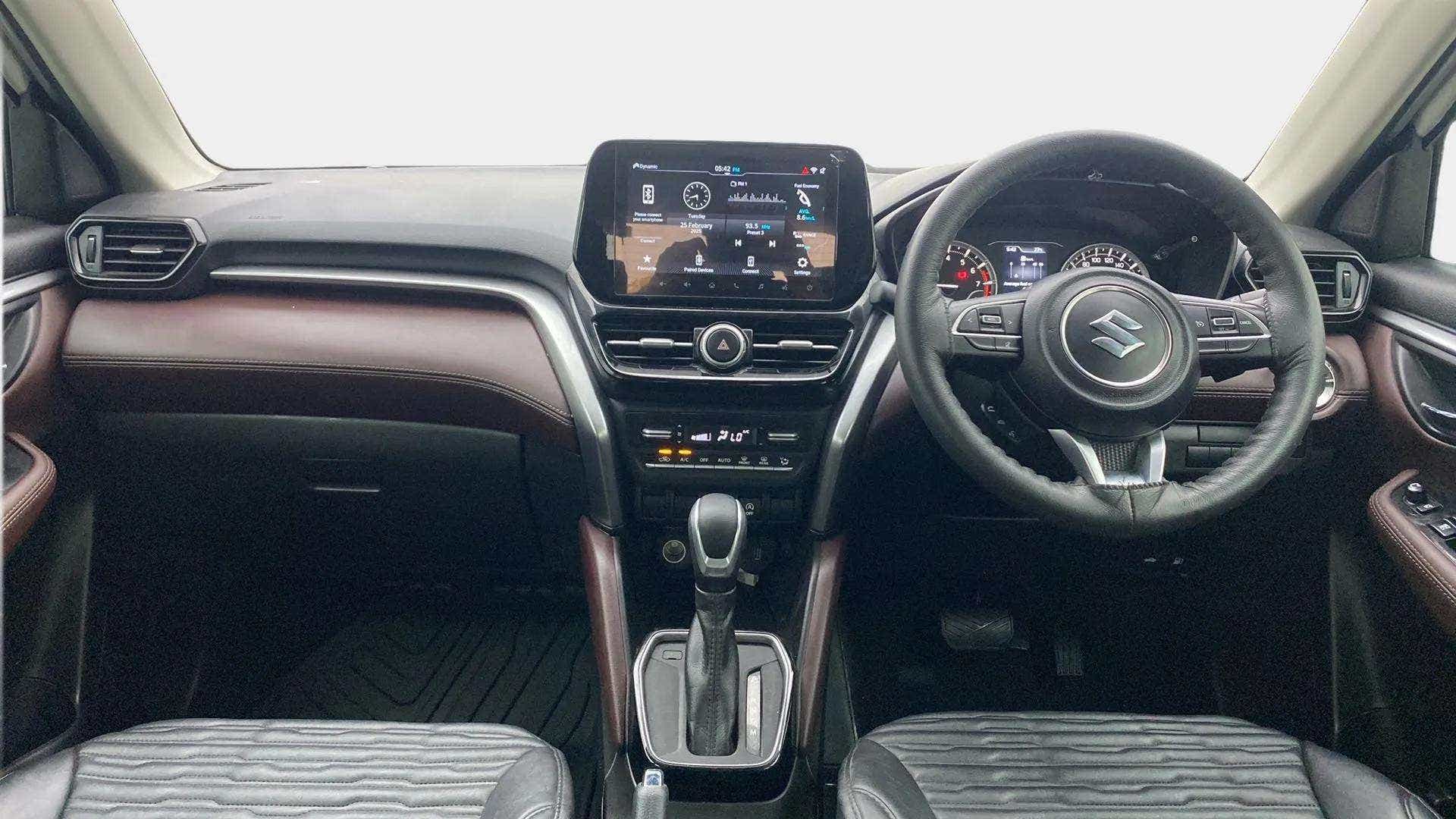 Dashboard and steering view of a Maruti Suzuki Grand Vitara