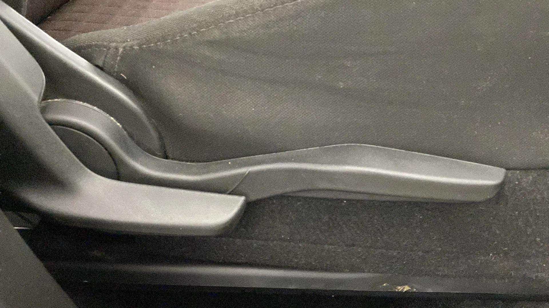 Seat adjustment lever of a Maruti Suzuki Grand Vitara