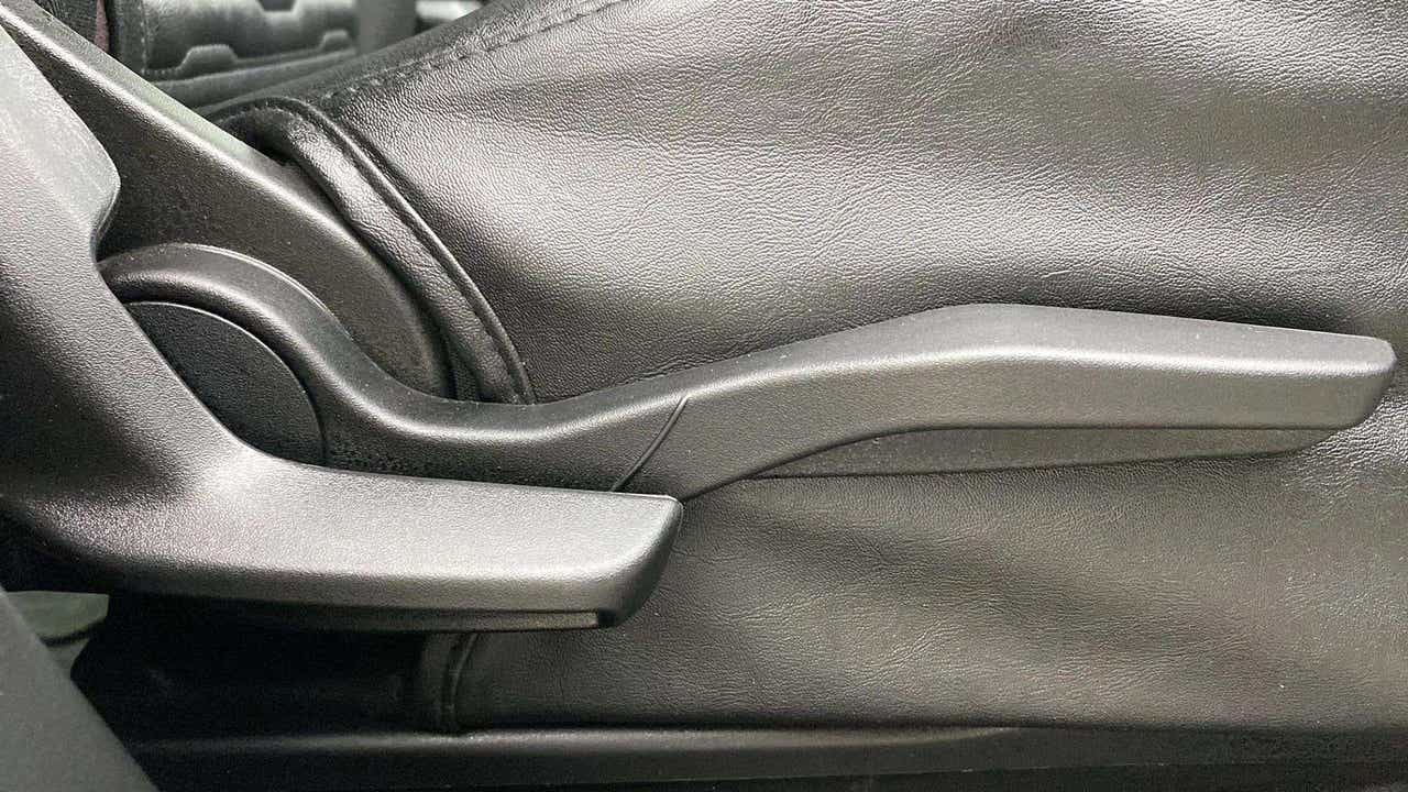 Close-up of the handbrake lever of a Maruti Suzuki Grand Vitara