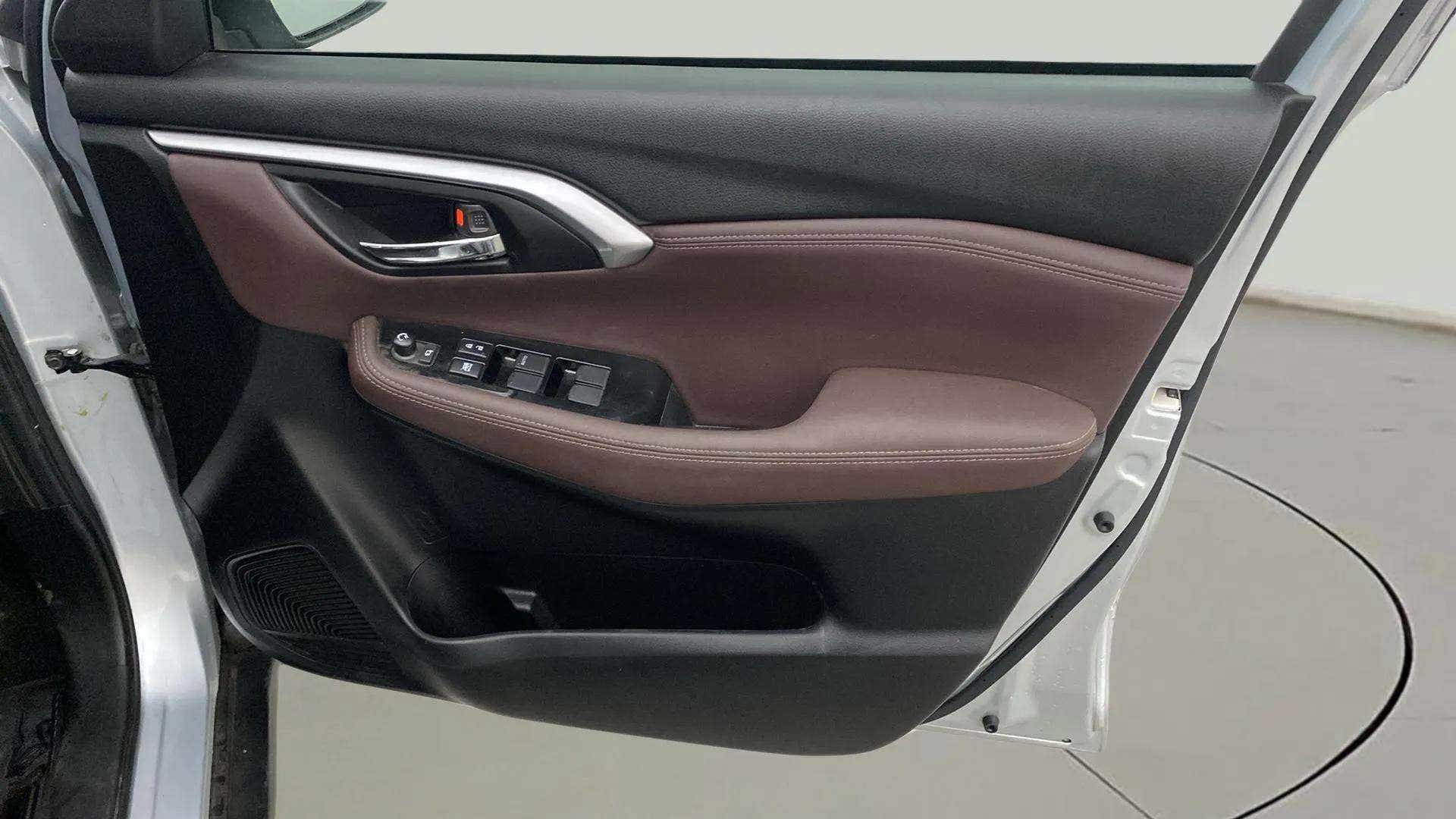 Interior driver side door panel of a Maruti Suzuki Grand Vitara