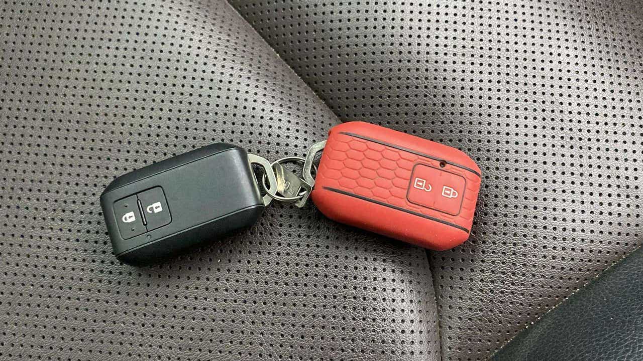 Close-up of car key fobs on a Maruti Suzuki Grand Vitara seat