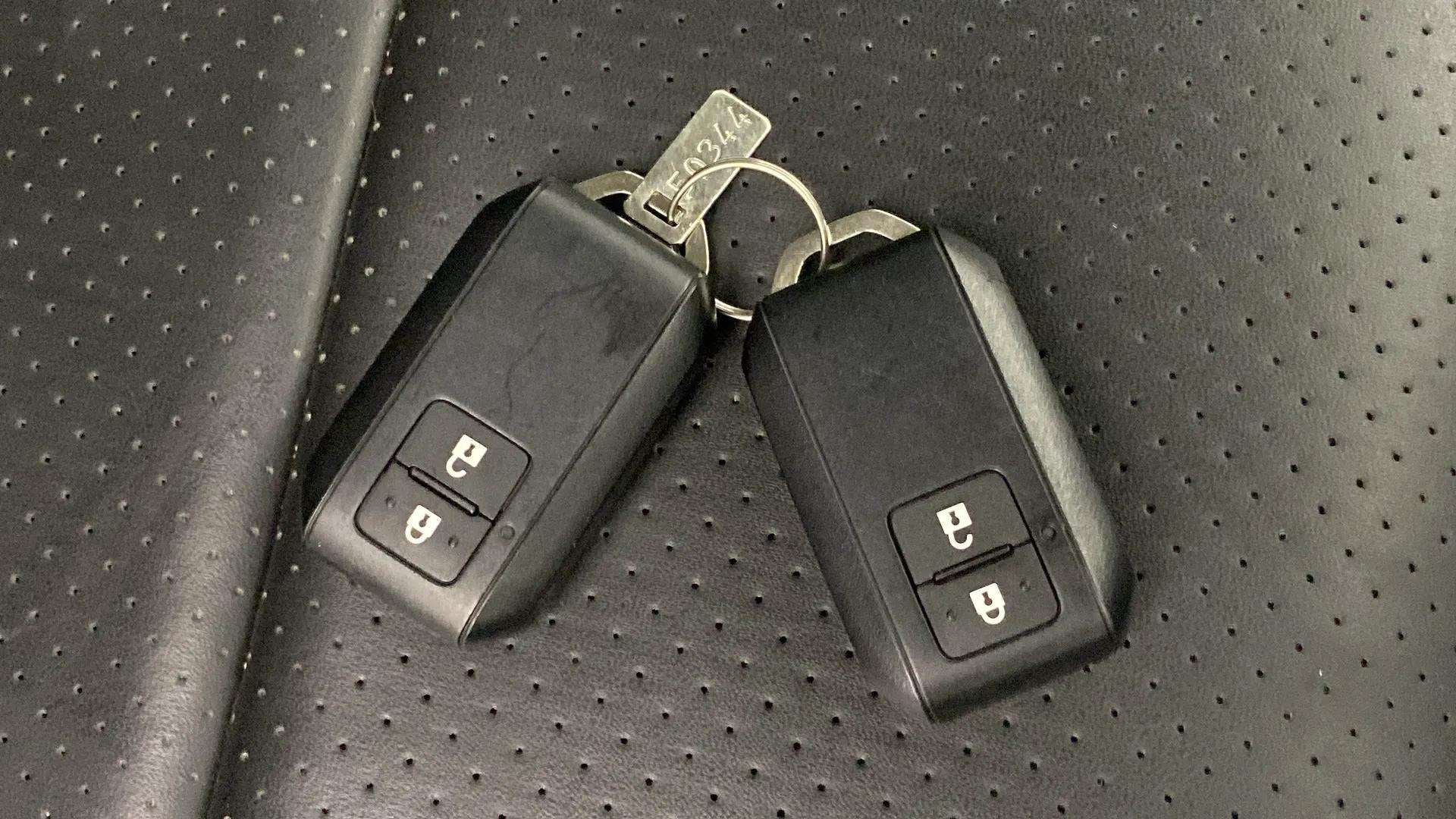 Car key fobs on the seat of a Maruti Suzuki Grand Vitara