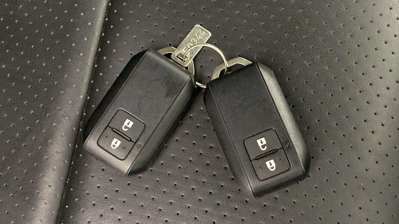 Car key fobs on the seat of a Maruti Suzuki Grand Vitara