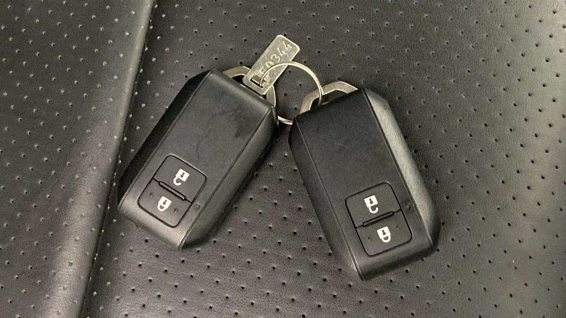 Car key fobs on the seat of a Maruti Suzuki Grand Vitara
