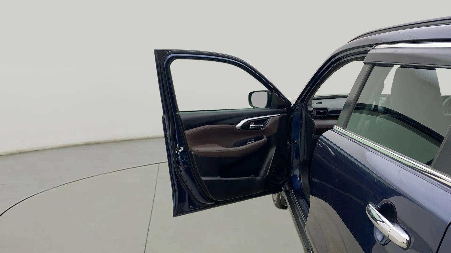 Driver side front door open view of a Maruti Suzuki Grand Vitara
