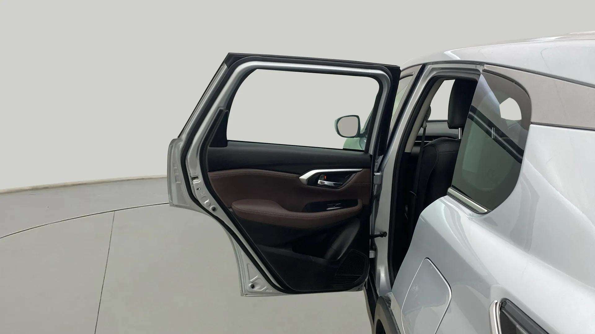 Left rear door open view of a Maruti Suzuki Grand Vitara