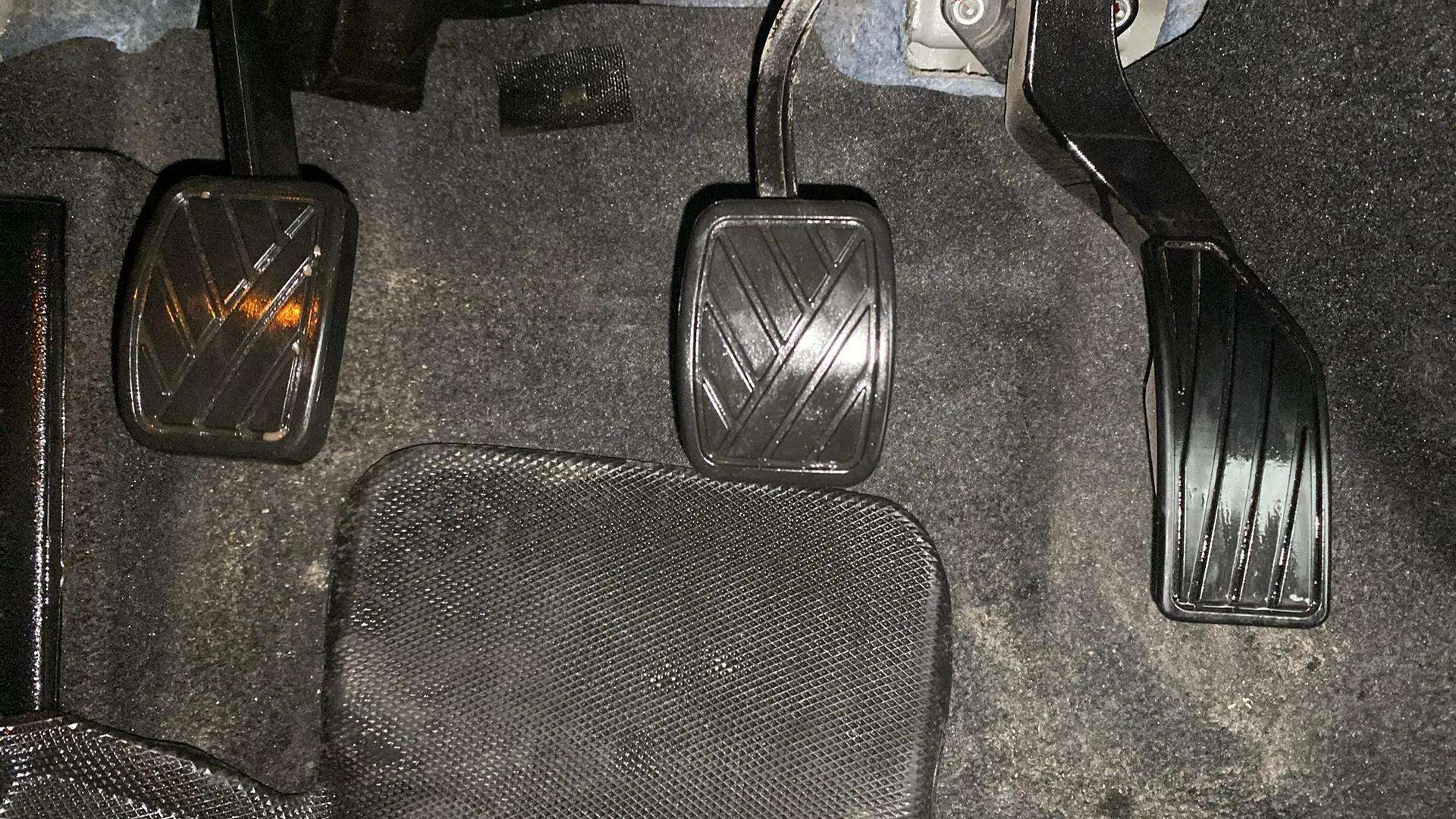 Footwell area showing clutch, brake, and accelerator pedals of a Maruti Suzuki Grand Vitara