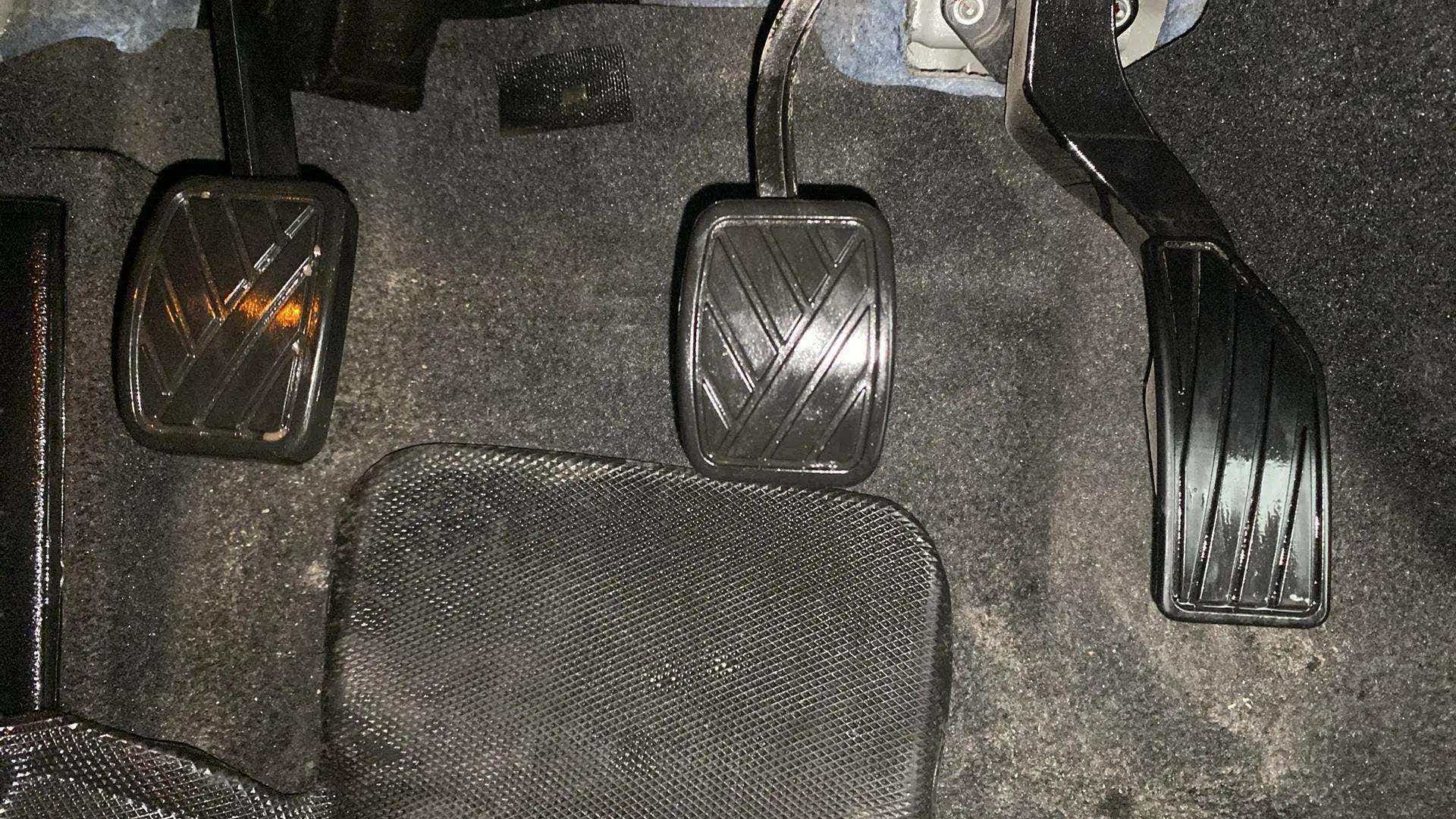 Footwell area showing clutch, brake, and accelerator pedals of a Maruti Suzuki Grand Vitara