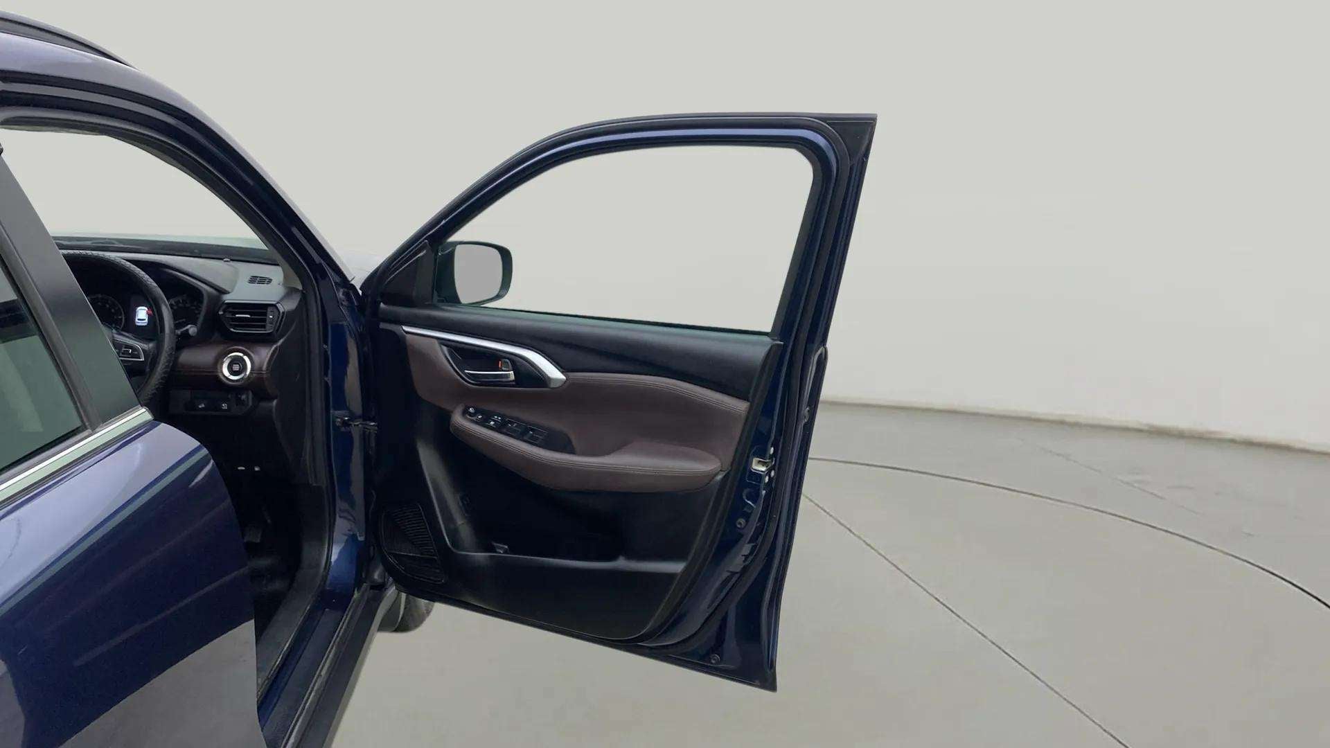 Driver side door and dashboard of a Maruti Suzuki Grand Vitara