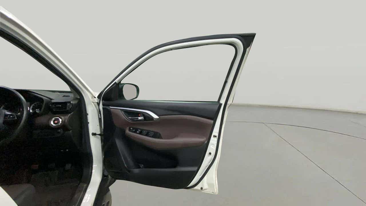 Driver side front door open view of a Maruti Suzuki Grand Vitara