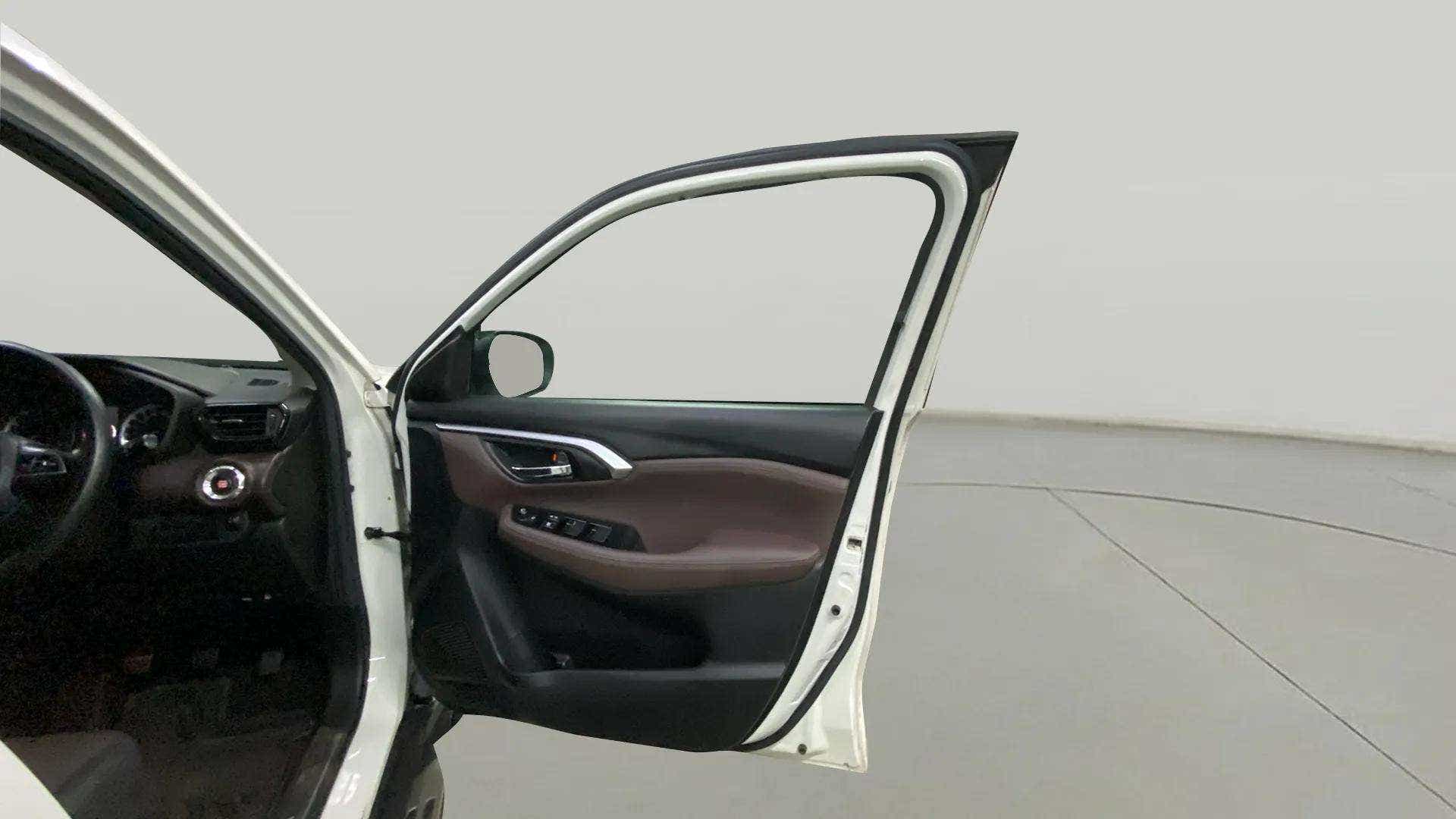 Driver side front door open view of a Maruti Suzuki Grand Vitara