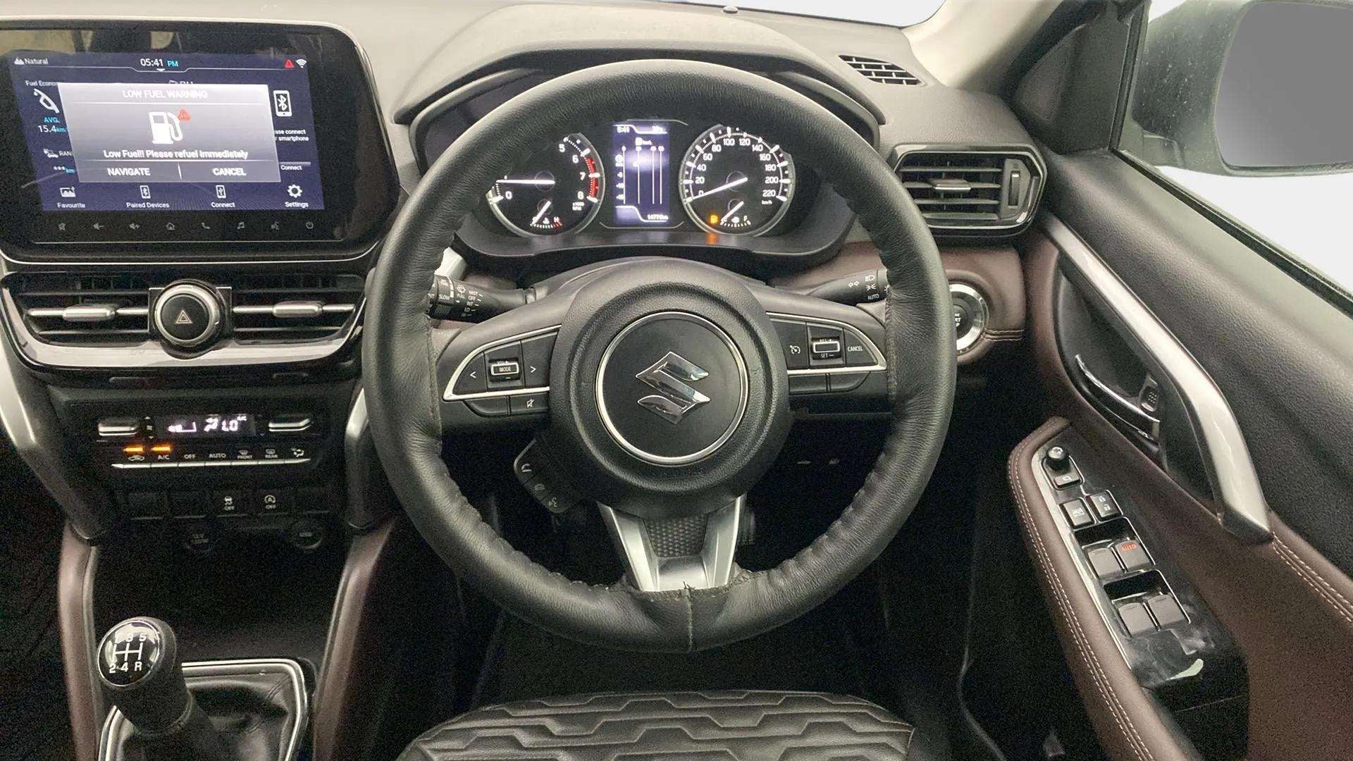 Dashboard and steering wheel of a Maruti Suzuki Grand Vitara