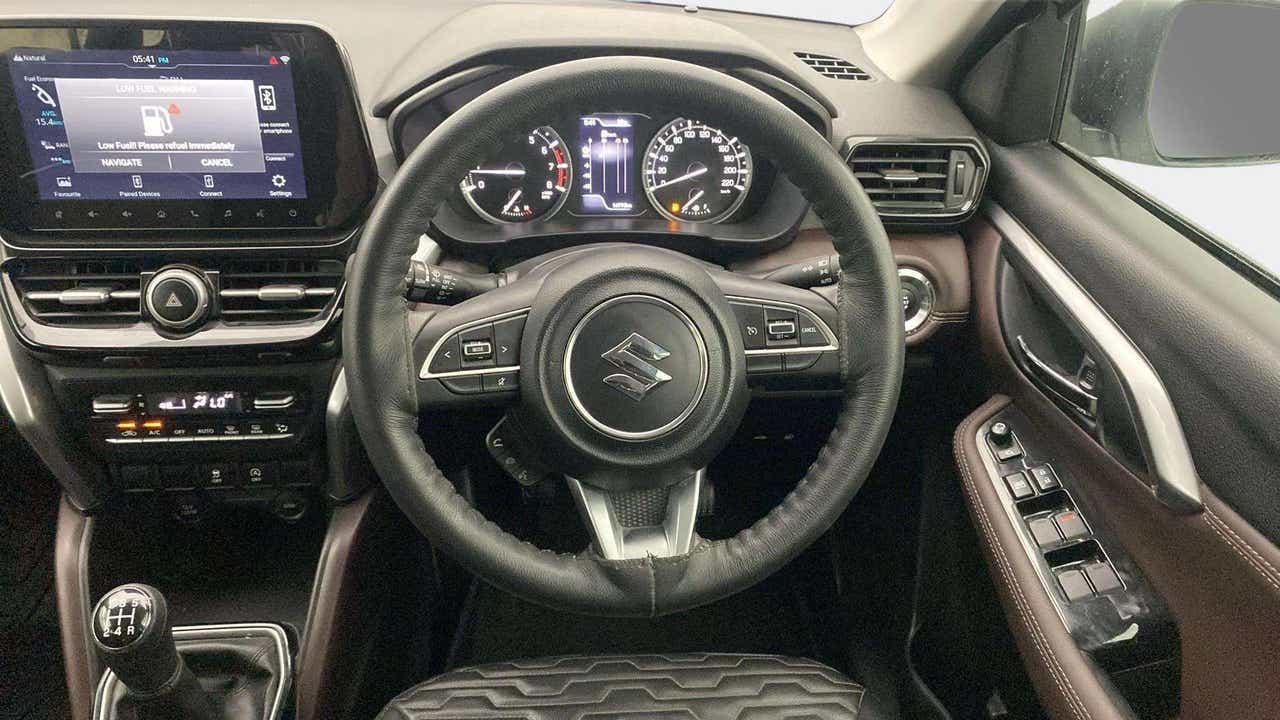 Dashboard and steering wheel of a Maruti Suzuki Grand Vitara