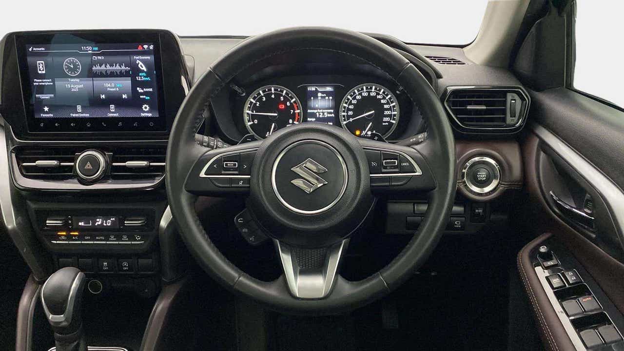 Dashboard and steering wheel of a Maruti Suzuki Grand Vitara